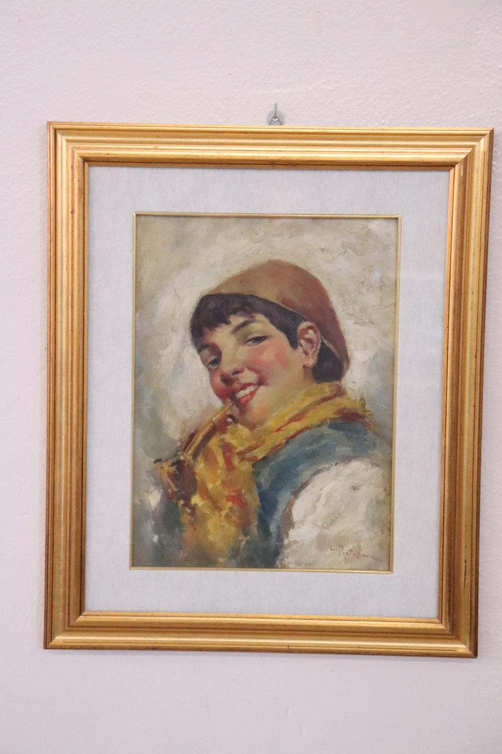 Dipinto a olio su tavola firmato in basso a destra in rosso L. Postiglione. Ritratto di una giovane donna. Non esiste una data precisa di esecuzione del dipinto, che probabilmente risale ai primi decenni del XX secolo. Lavori senza certificati di