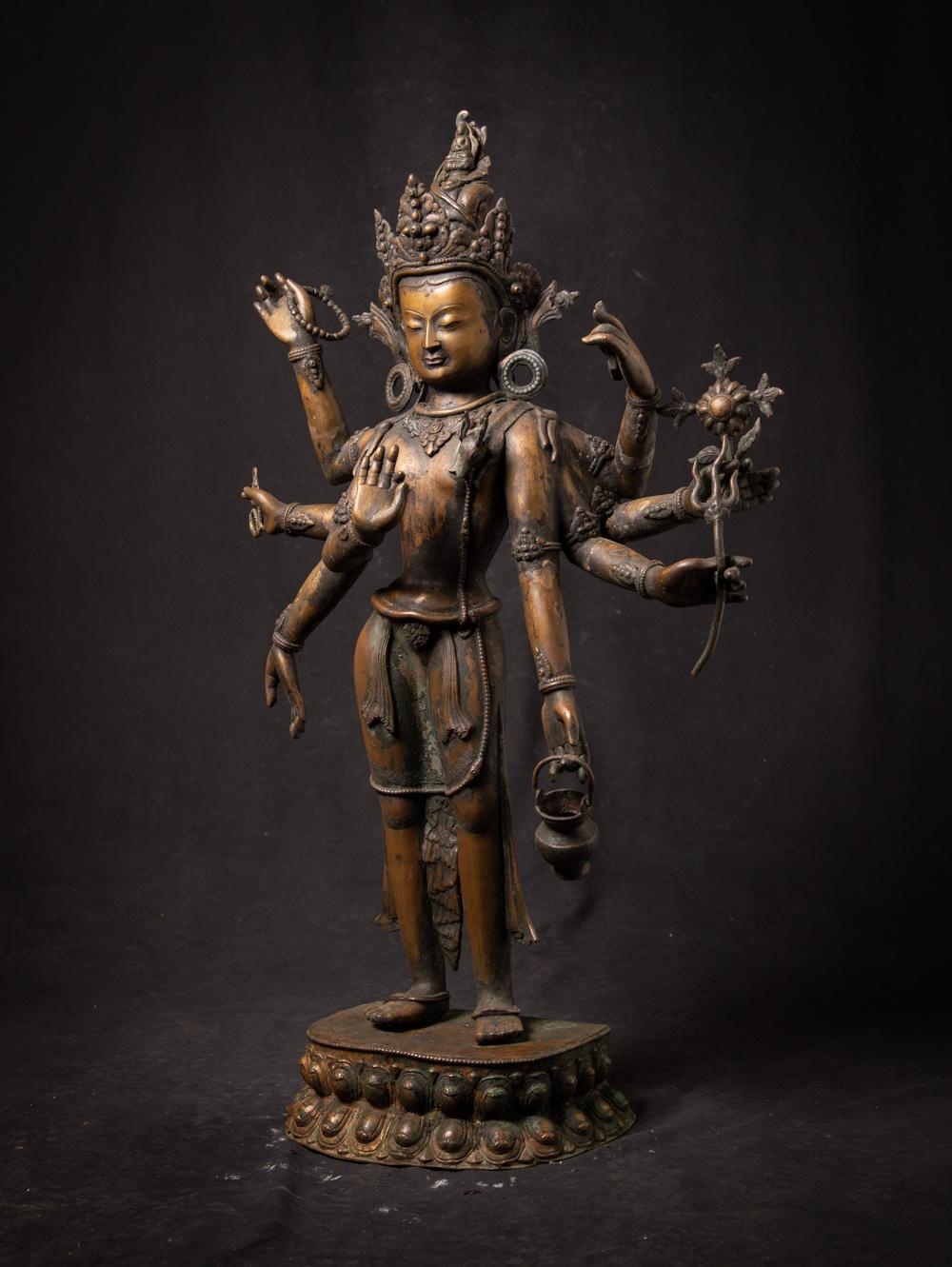 The old bronze Nepali Bodhisattva statue is a truly exceptional and sacred artifact originating from Nepal. Crafted from bronze, this Bodhisattva statue stands at an impressive height of 85 cm and measures 54.5 cm in width and 19 cm in depth. The