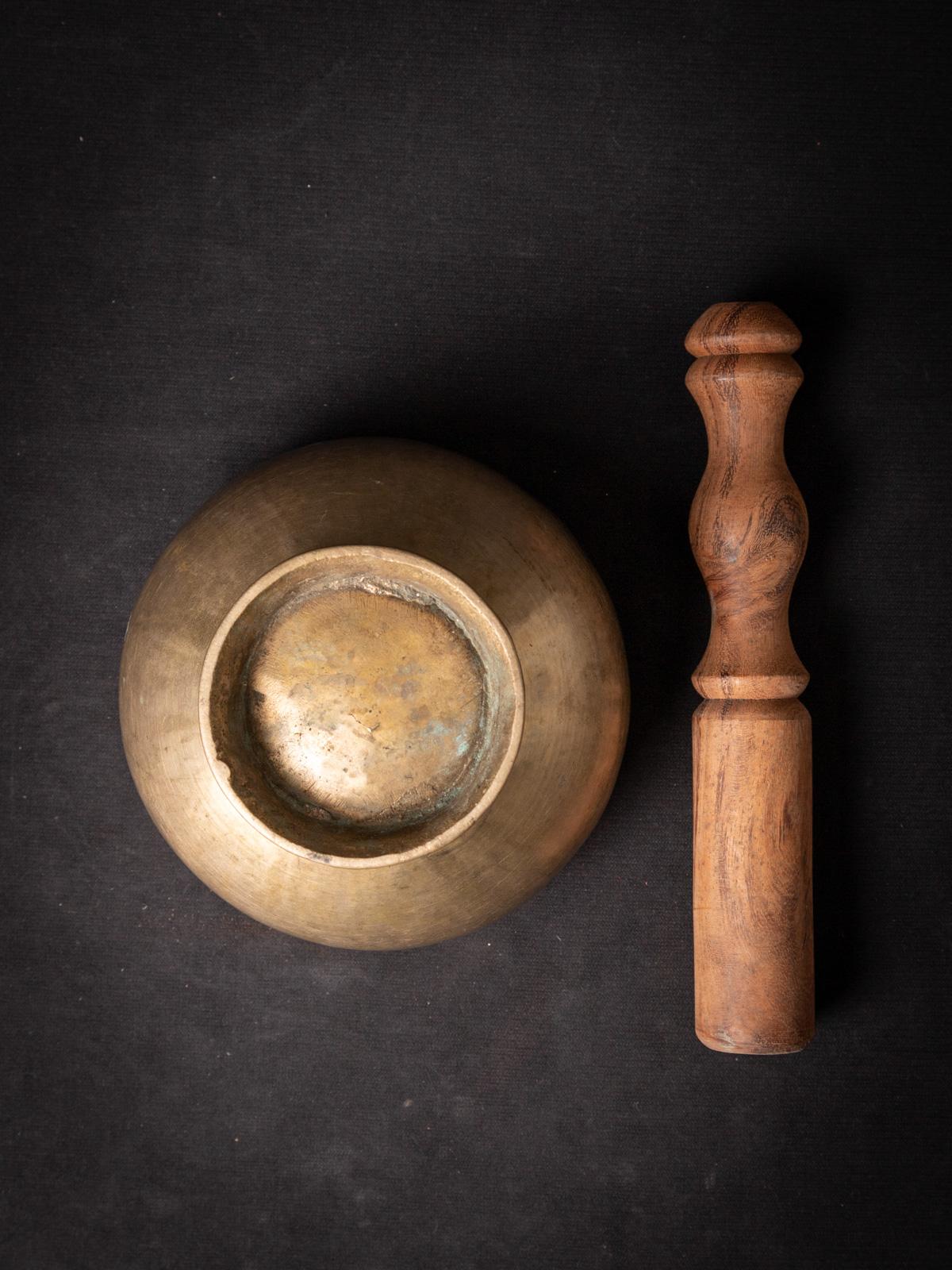 Experience the Timeless Harmonies of an Old Bronze Nepali Singing Bowl: A Musical Treasure from the Early 20th Century

Immerse yourself in the enchanting world of ancient sounds with this exquisite old bronze Nepali singing bowl. Crafted with