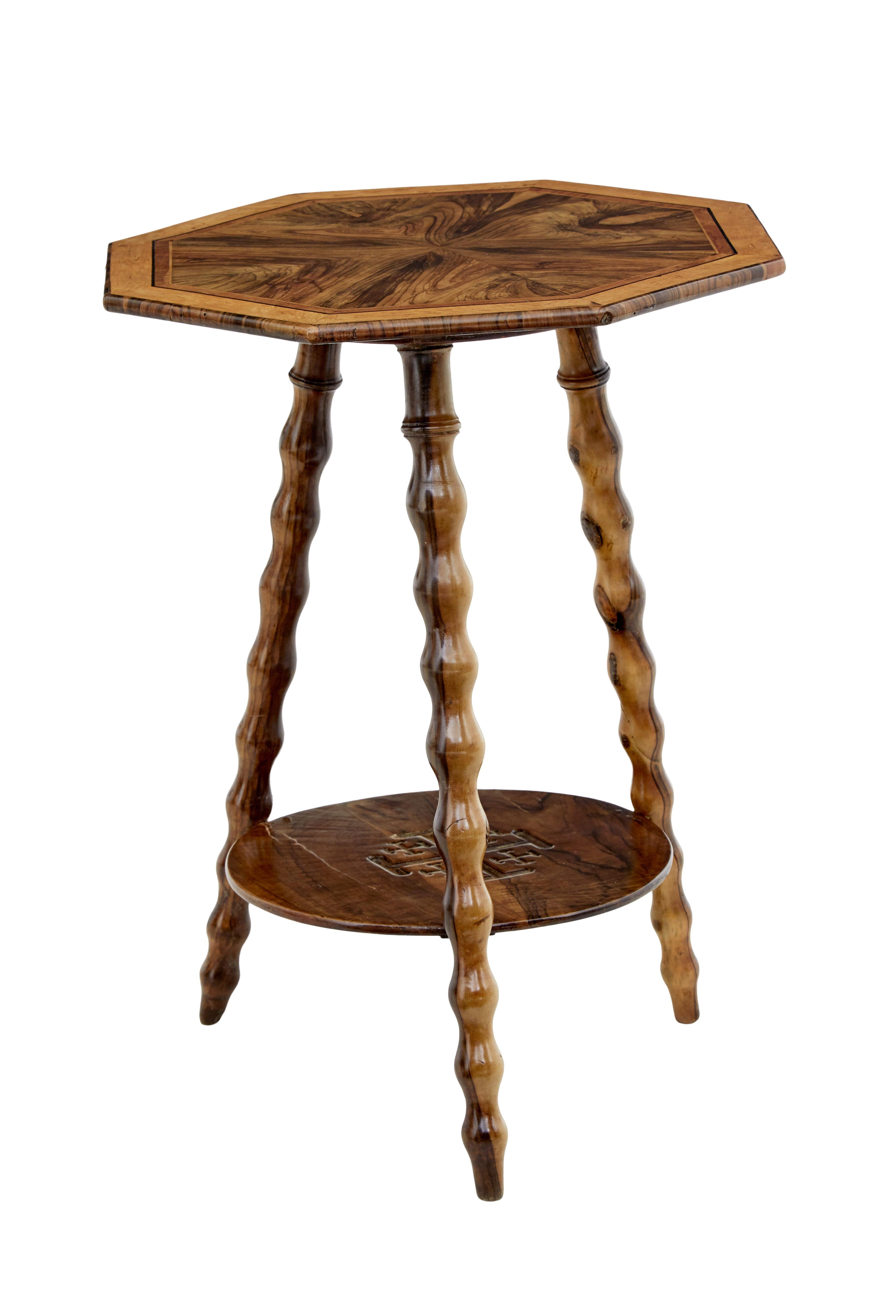 Early 20th century olive wood Jerusalem table, circa 1900.

Segment veneered in olive wood with various layers of stringing in exotic woods, with solid olive wood outer edge.

Standing on 3 bobbin turned legs, geometric design to lower