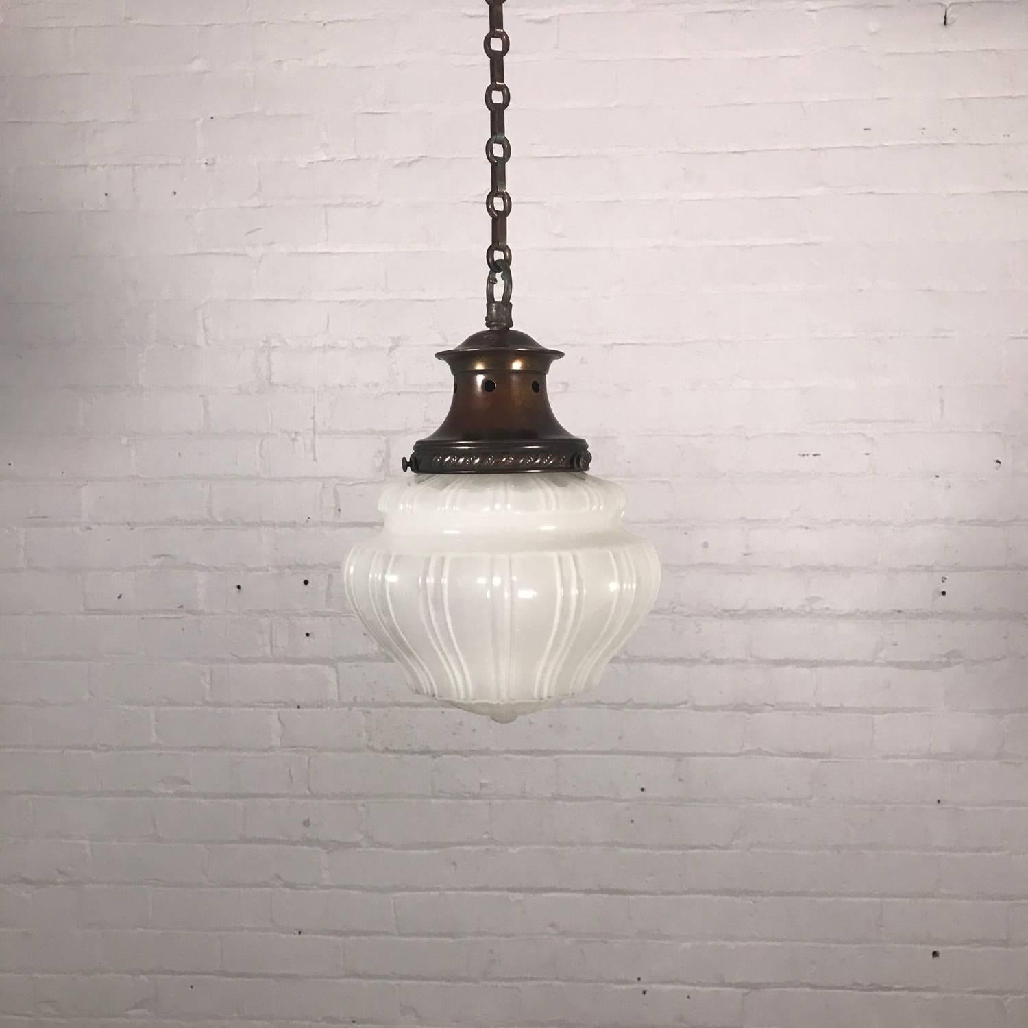 Early 20th century opal glass pendant light, with anodised copper gallery and chain. Stamped 'Made in England'
Measures: 23cm / 9