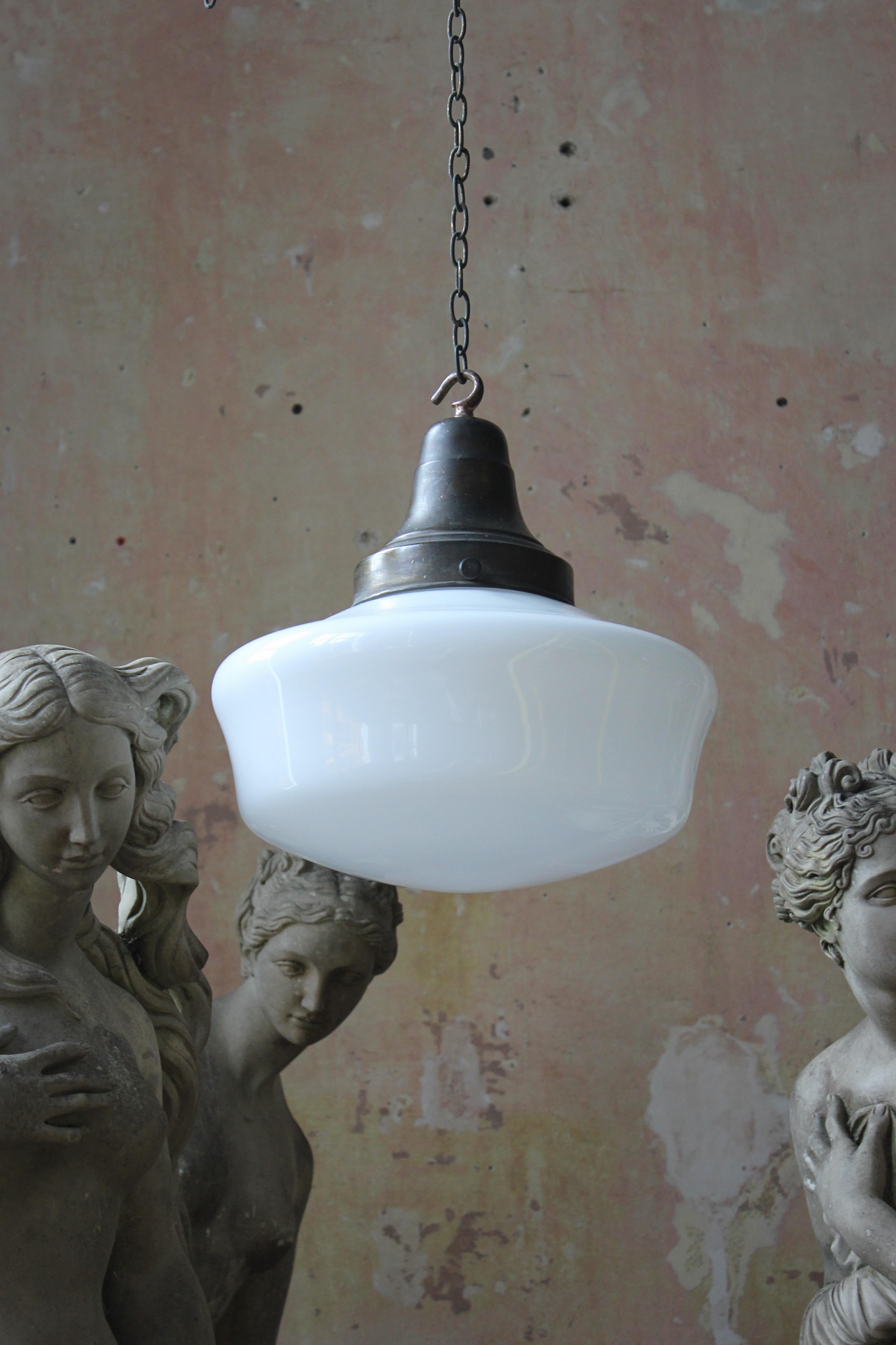 A good glass opaline pendant, with its original decorative brass spun gallery.

The light has its original brass chain approx 60cm in length, comes with a solid brass antique style ceiling hook, three core silk flex and a new b22 bulb holder ready