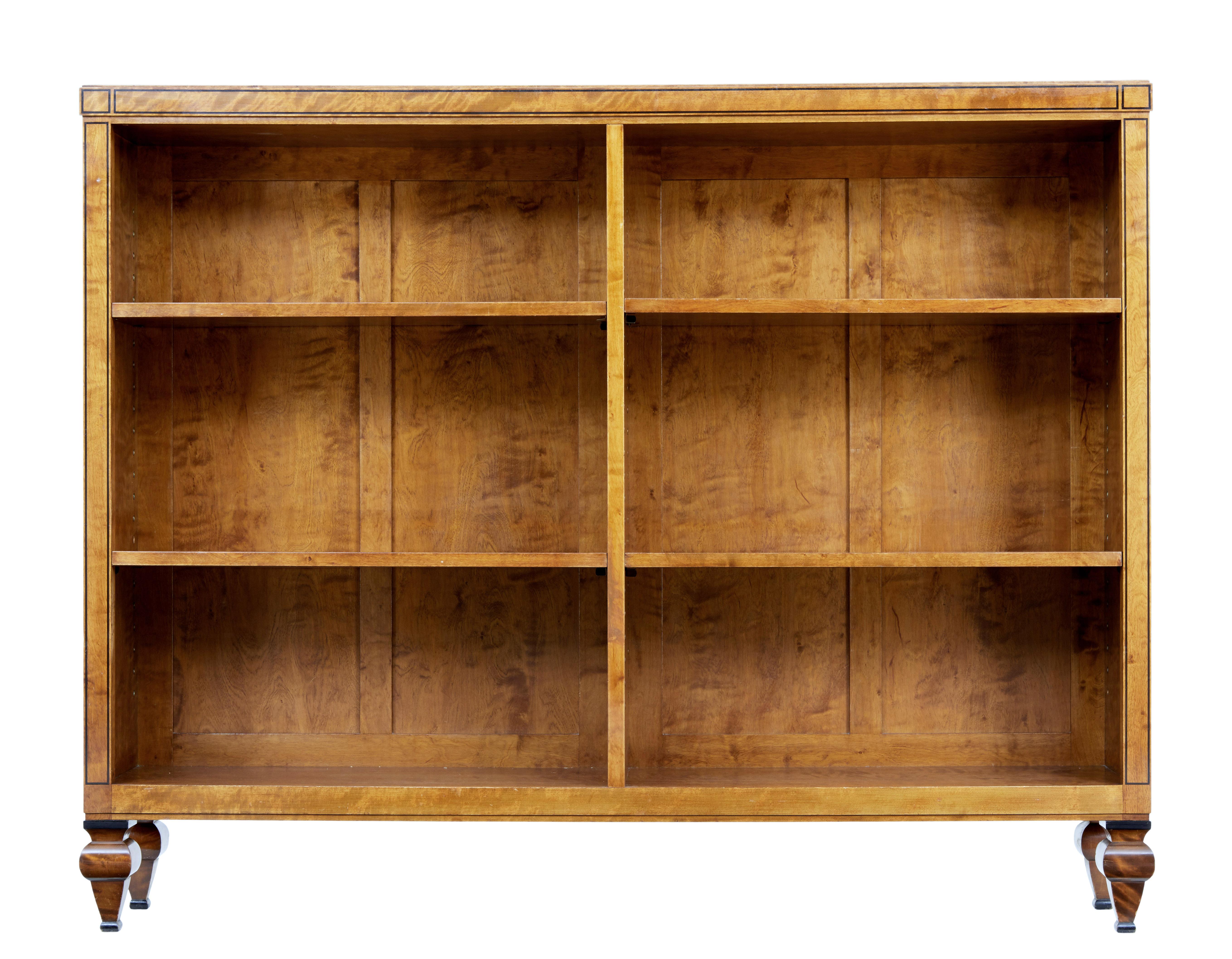 Fine quality art deco period bookcase attributed to David Blomberg, circa 1923.

We have further items from this suite including a sofa, pair of armchairs, 3 single chairs and a table.

Made from quality birch veneers, with ebony stringing.