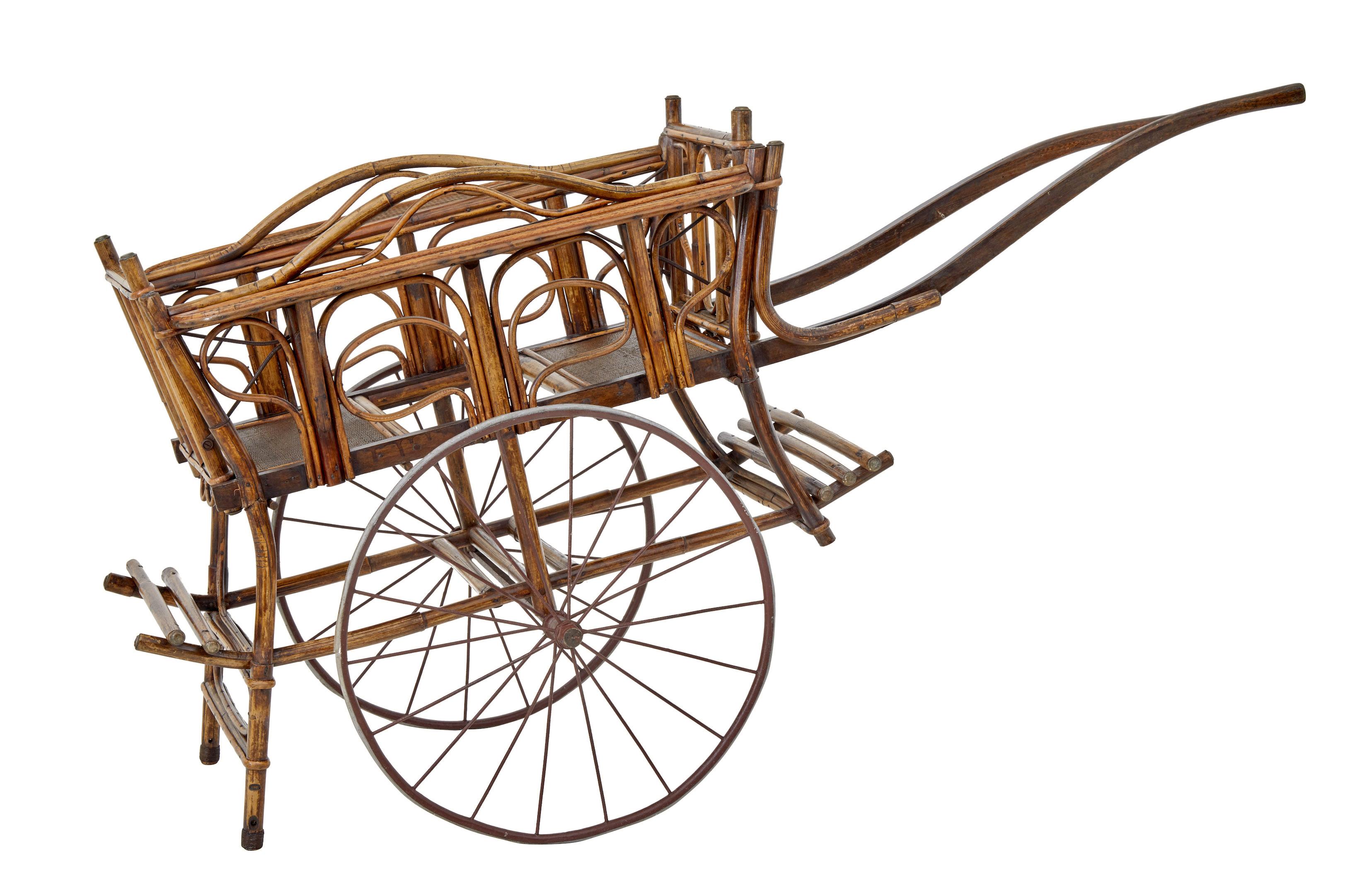Unusual possibly chinese bamboo 2 seater children's carriage circa 1900.

Made from shaped bamboo, bound in the traditional way with additional iron work supports.
Backs of seats flip over so the children can sit back to back or facing each