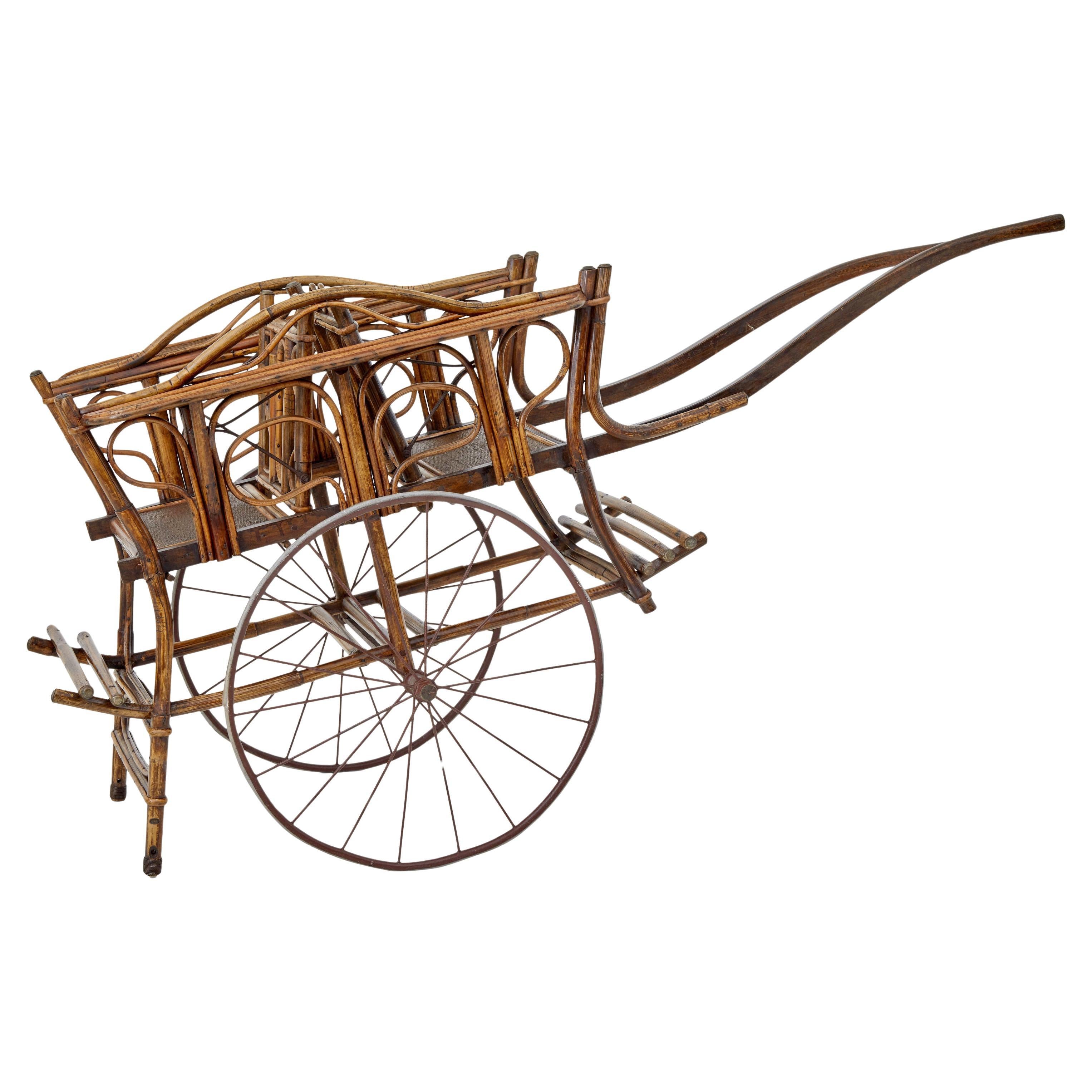 Early 20th century oriental bamboo 2 seat child carriage