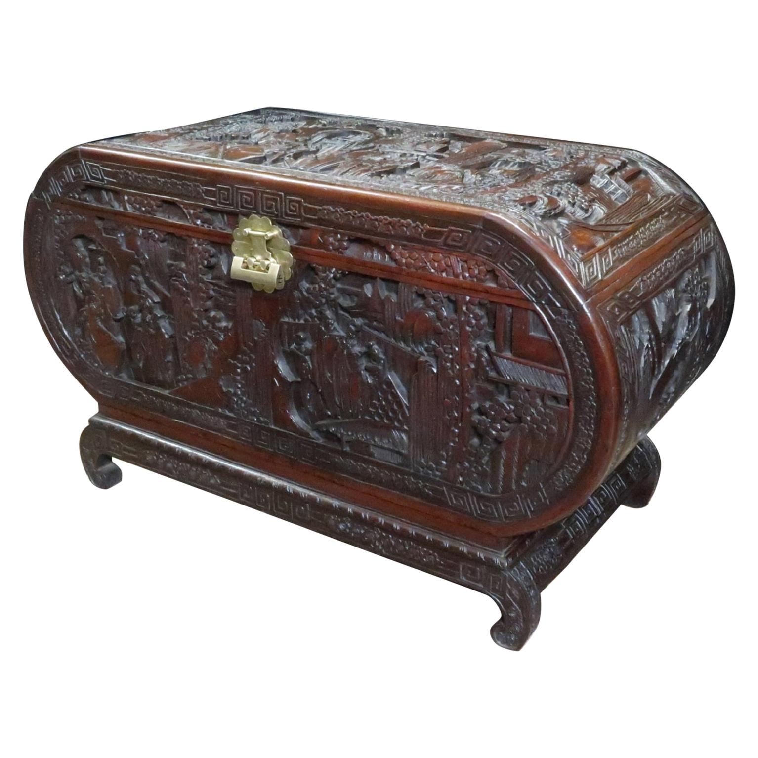 Early 20th Century Oriental Oval Shaped Camphor Wood and Teak Carved Chest For Sale