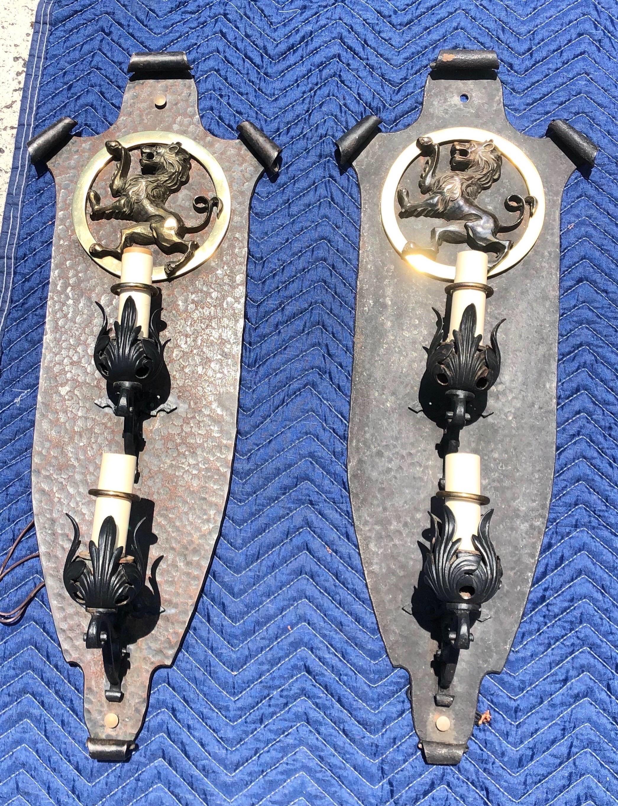 Incredible set of 8 Oscar Bach style sconces in hand-hammered metal and polished brass from the Arts & Crafts period. 


Available by the pair- 3 pairs are 30” x 11