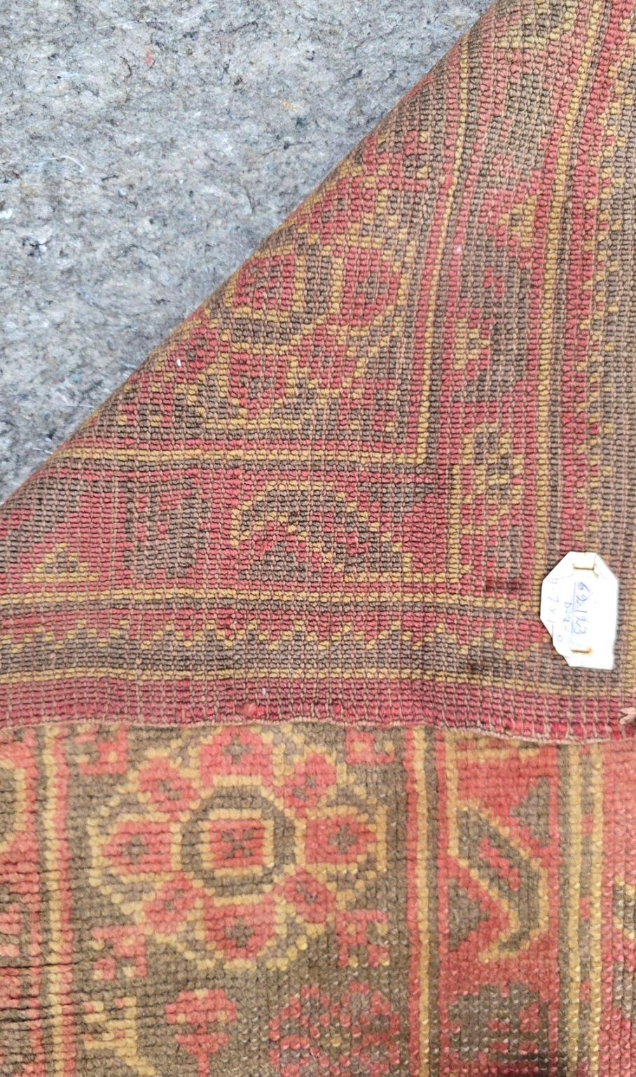 Bring a touch of timeless Anatolian artistry into your home with this antique Turkish Oushak rug, a rare and exquisite piece dating back to the 1920s. Measuring 9.7 x 11.8 feet, this rug features a striking sky-green field adorned with oversized