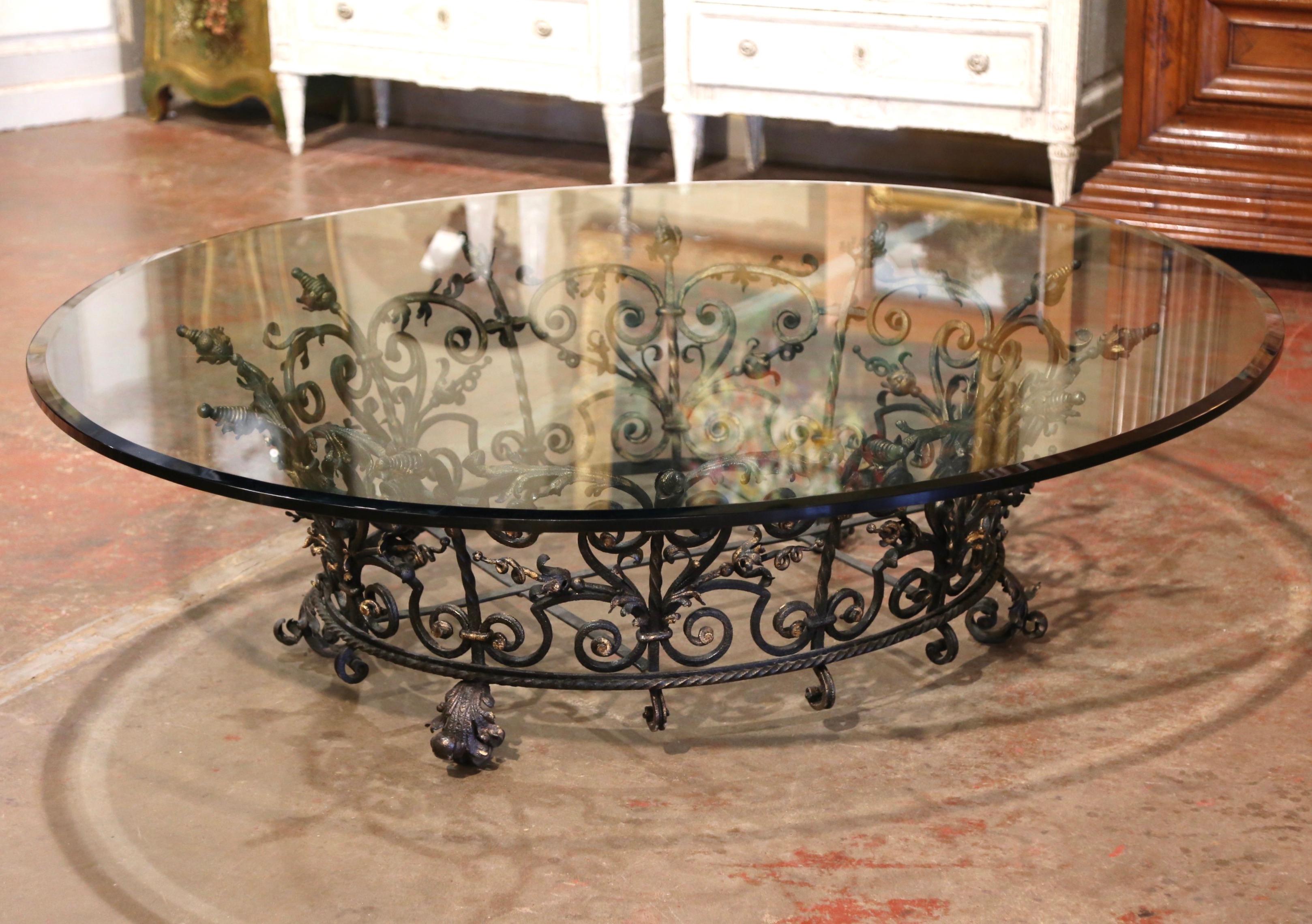 This incredibly heavy round low table would make an interesting addition to any living room, sitting area, office, or den-- it could even be used on a back patio or porch. The black metal base was crafted using ornate antique wrought iron from