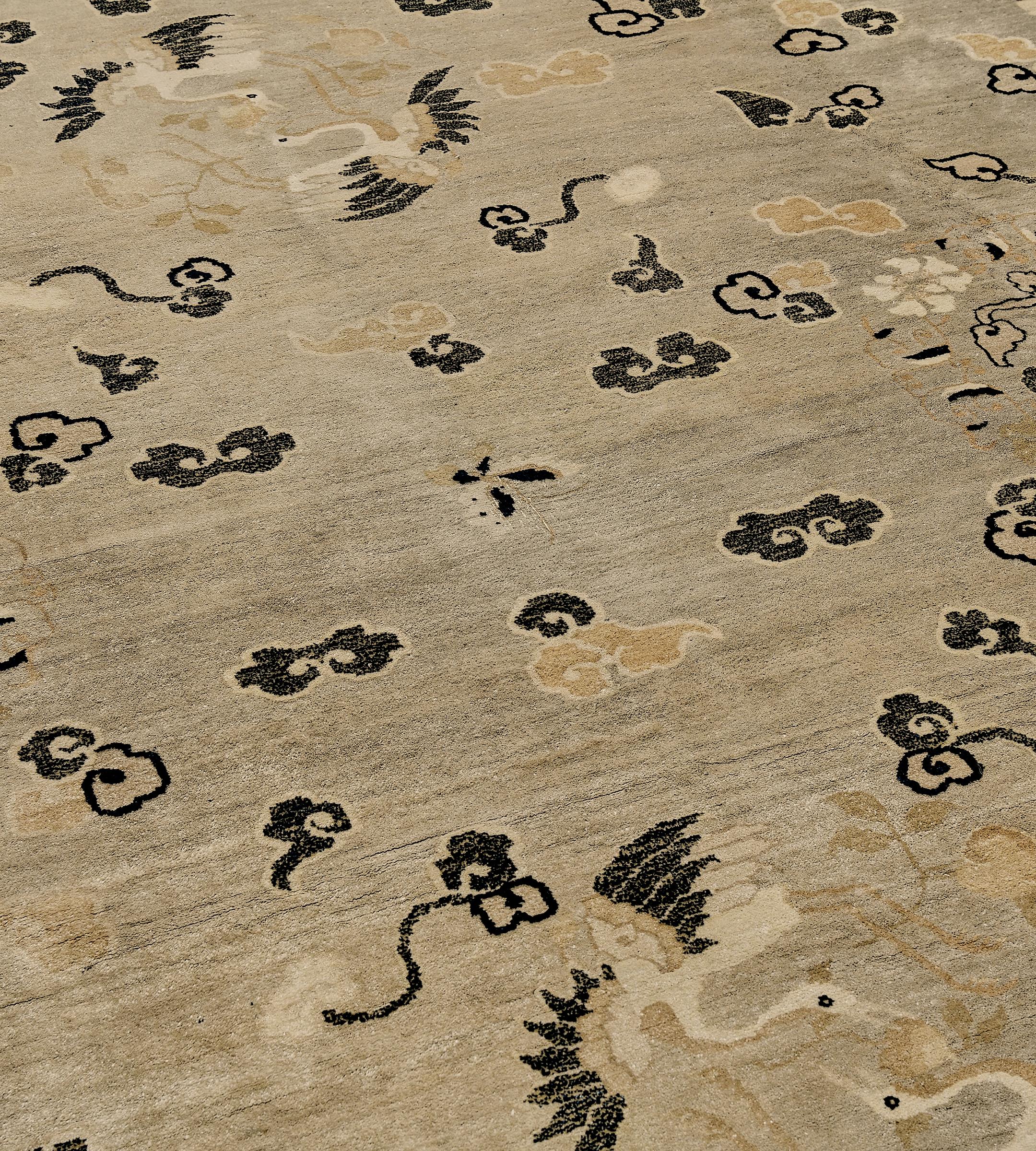 This antique, circa 1940, Chinese rug features a mole-grey field scattered with charcoal-black, sandy-yellow and ivory auspicious symbols, including swans, cloud motifs and conch shells in a broad sandy-yellow border scattered with delicate floral