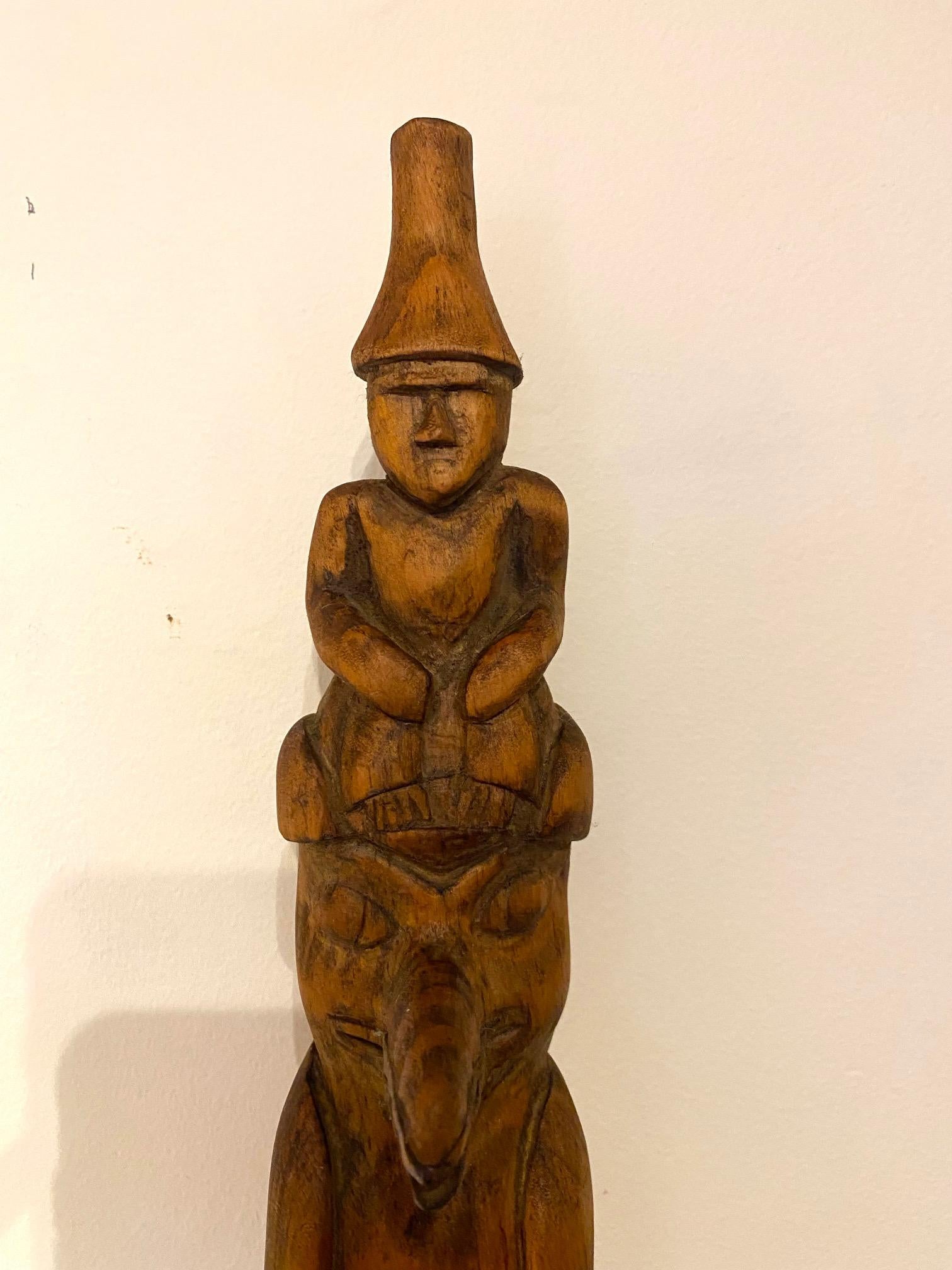 Antique Pacific Northwest Coast carved cedar Totem Pole, circa 1920s, a hand carved cedar pole featuring a man in conical hat (