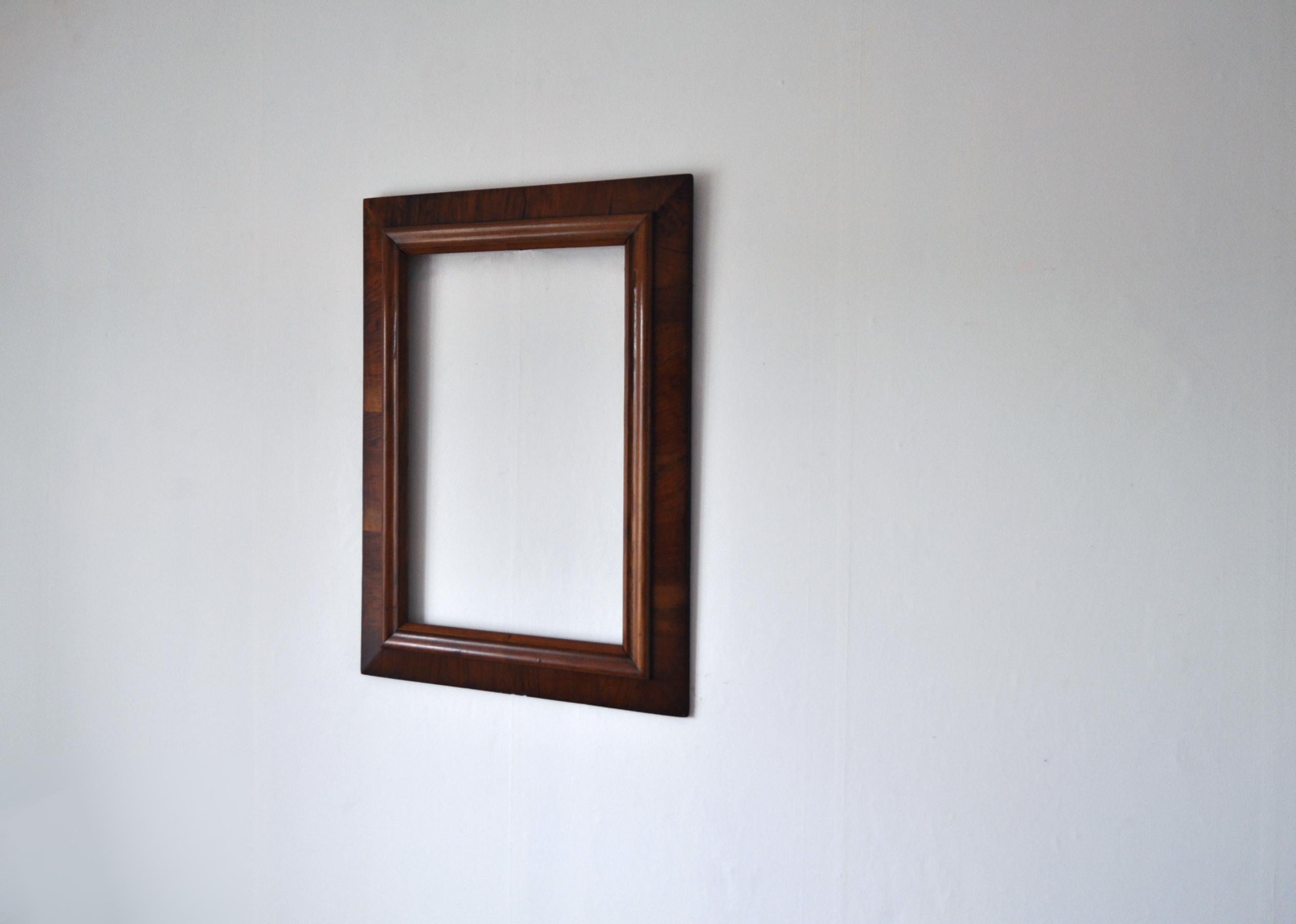 Early 20th century original walnut painting or mirror frame.
Wood in original condition.
Patinated with wear consistent with age and use.