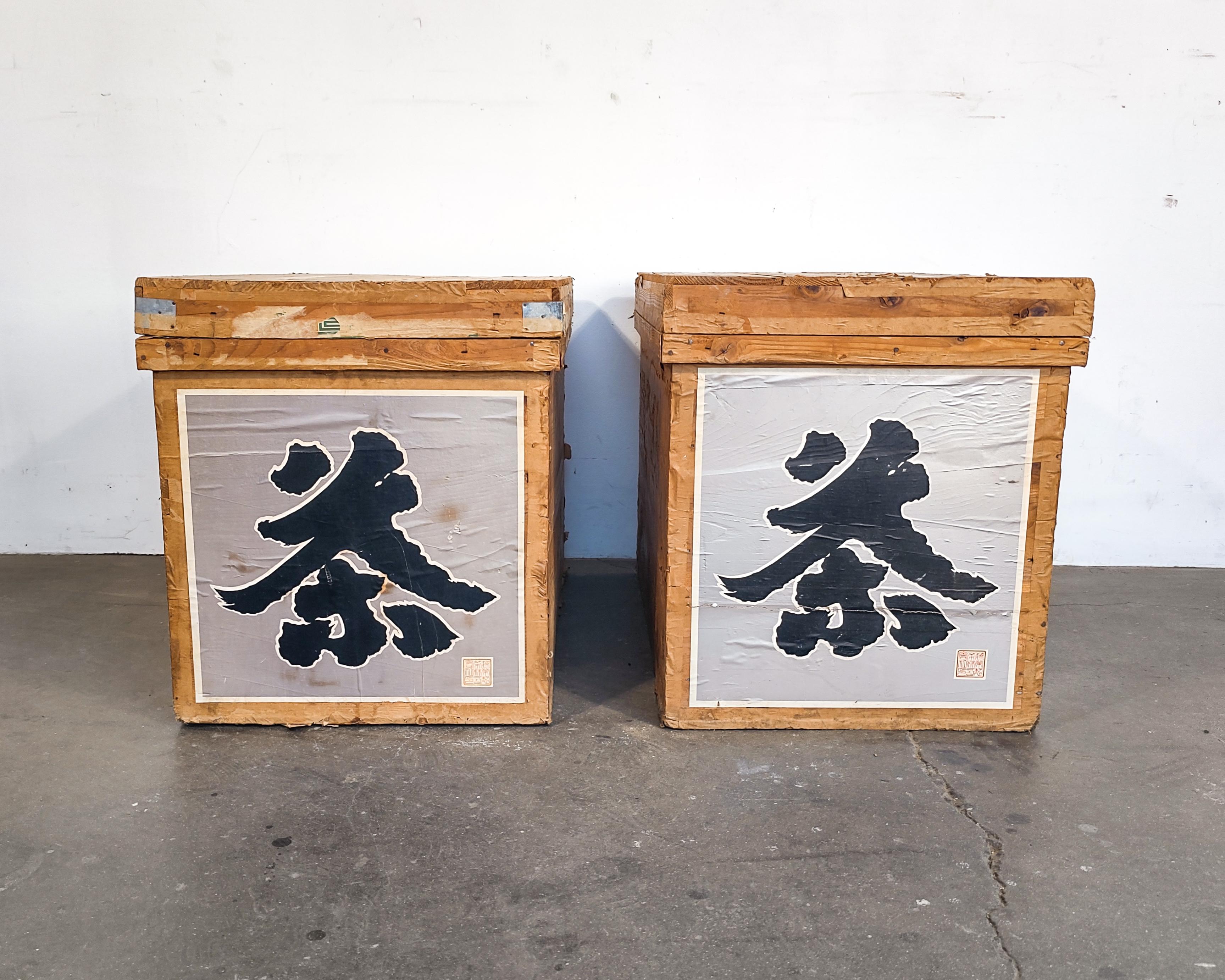 Set of two Japanese cedar wood tea crates circa 1960s. Original graphics and labels. Tin-lined interiors. 

Measures: 17