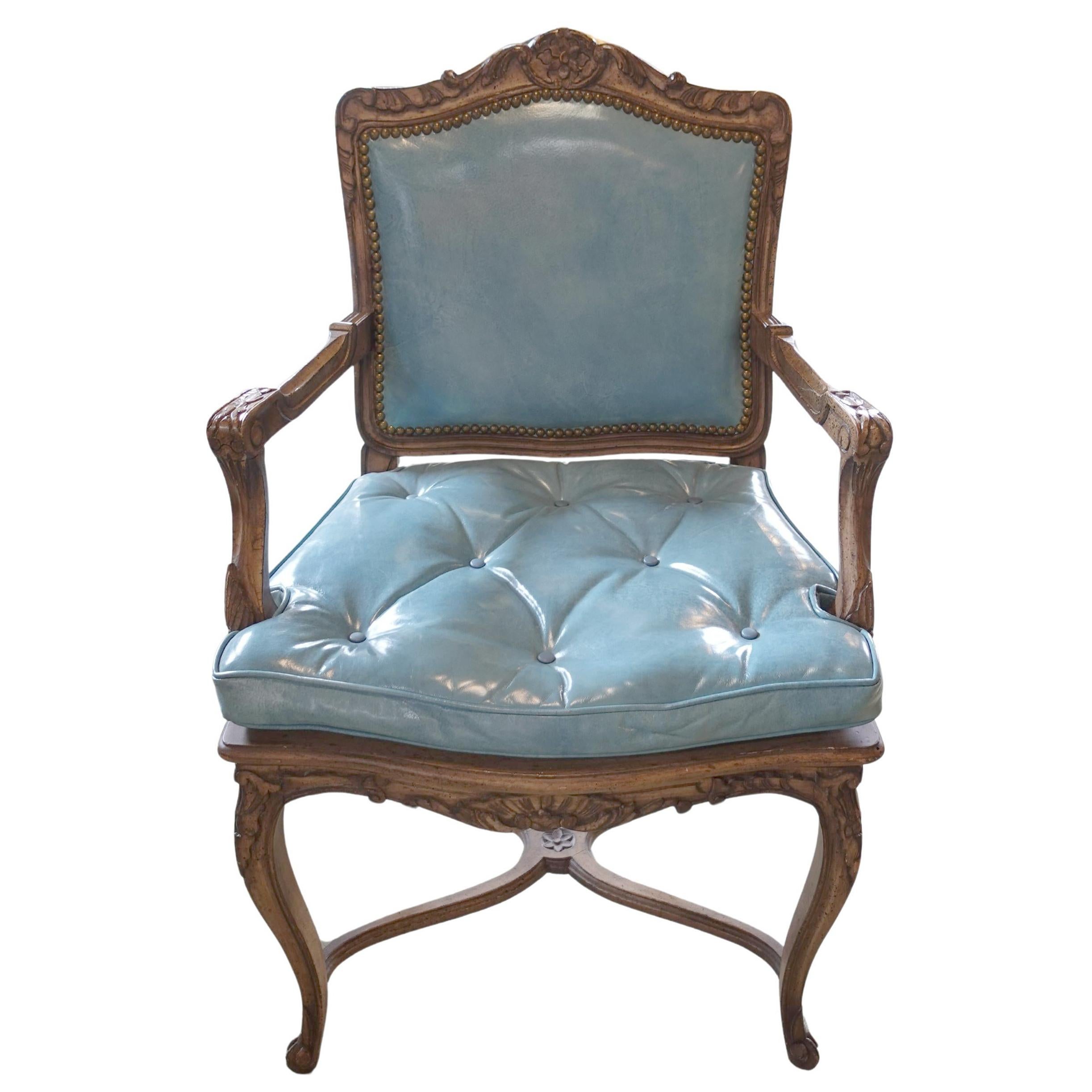 Early 20th century Pair of Blue Naugahyde Louis XV style Chairs

Approximate size:  37.5”H x 24”W x 20”D; seat height: 21”

This pair of Louis XV style dining chairs offer an intriguing material juxtaposition; their presumed walnut frames carved