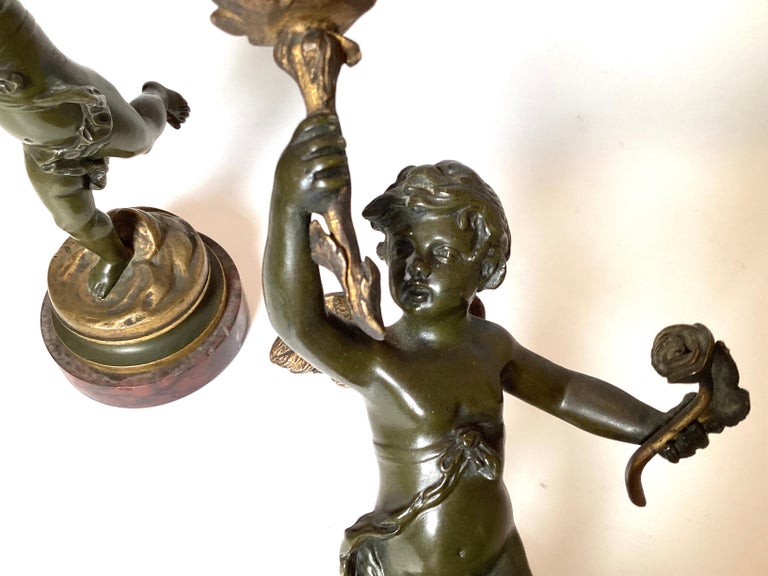 Early 20th Century Pair Of Bronze Cherub Candlesticks For Sale at 1stDibs