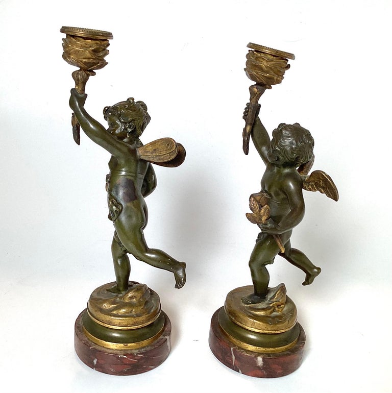 Early 20th Century Pair Of Bronze Cherub Candlesticks For Sale at 1stDibs