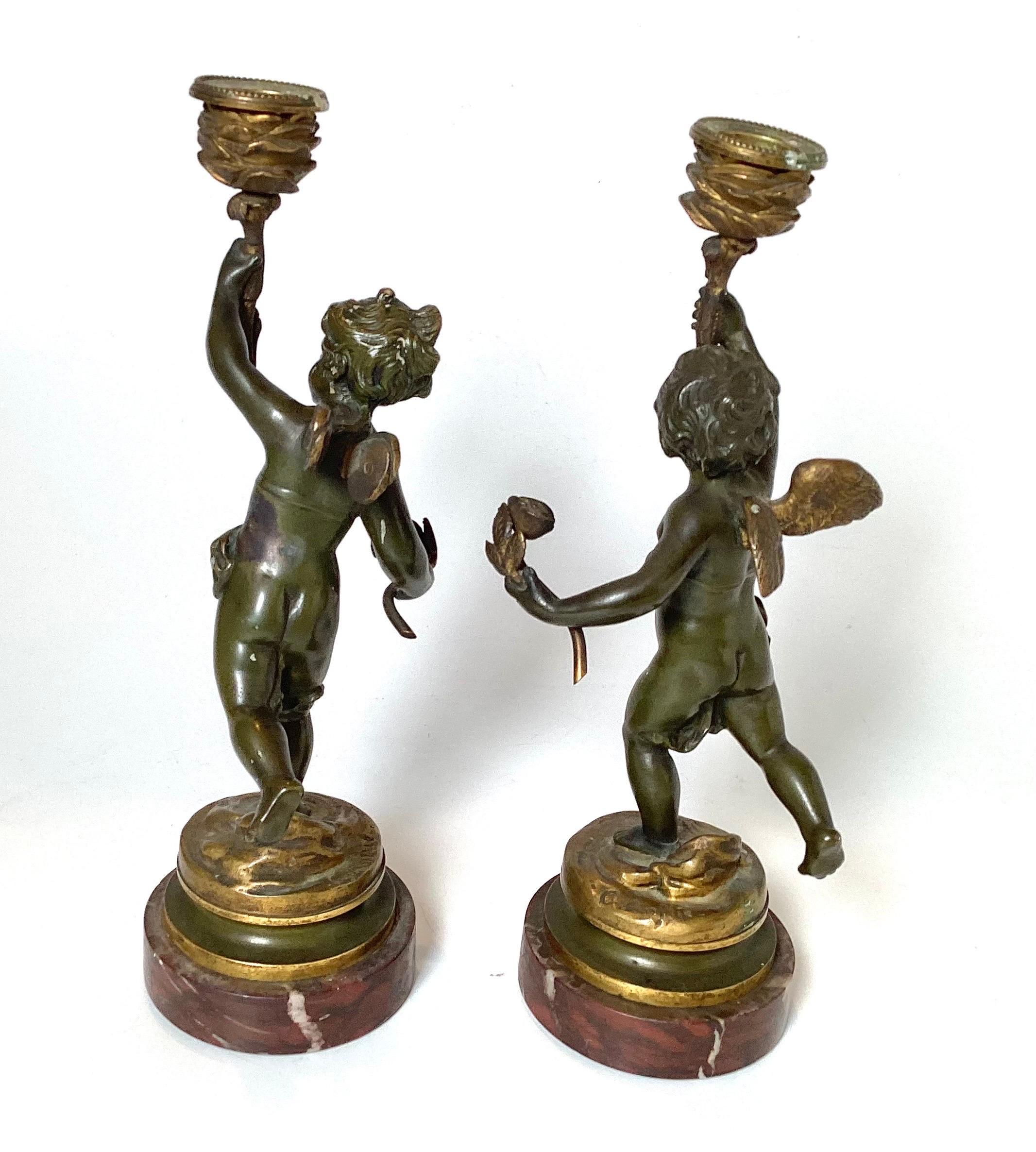 Early 20th Century Pair Of Bronze Cherub Candlesticks In Good Condition For Sale In Lambertville, NJ