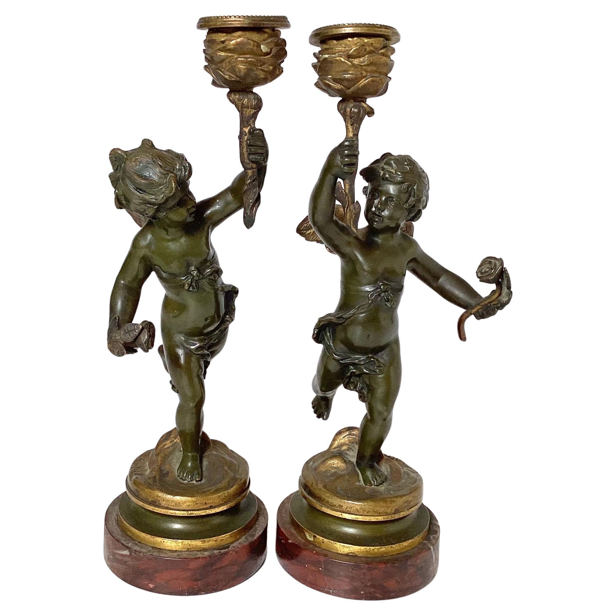 Early 20th Century Pair Of Bronze Cherub Candlesticks For Sale