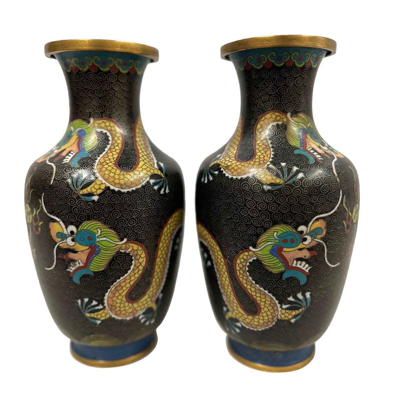 This Pair of magnificent Chinese Cloisonné Vases are the perfect decor pieces. with beautiful three dragons playing fire ball design, it is a majestically hand crafted work of art that is sure to capture everyone’s attention. Very beautiful. A lot