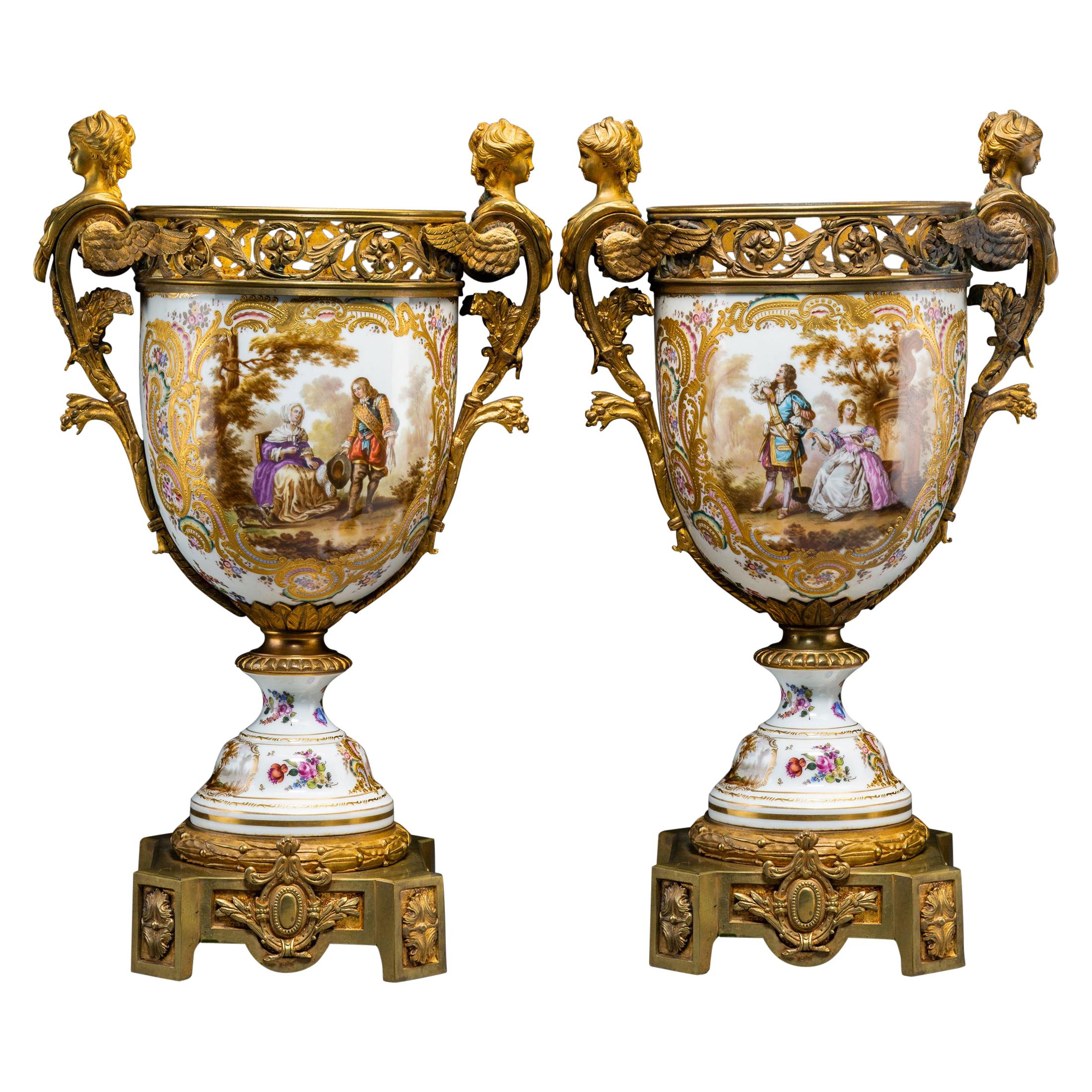 Early 20th Century Pair of Continental Gilt Bronze-Mounted Painted Porcelain Urn