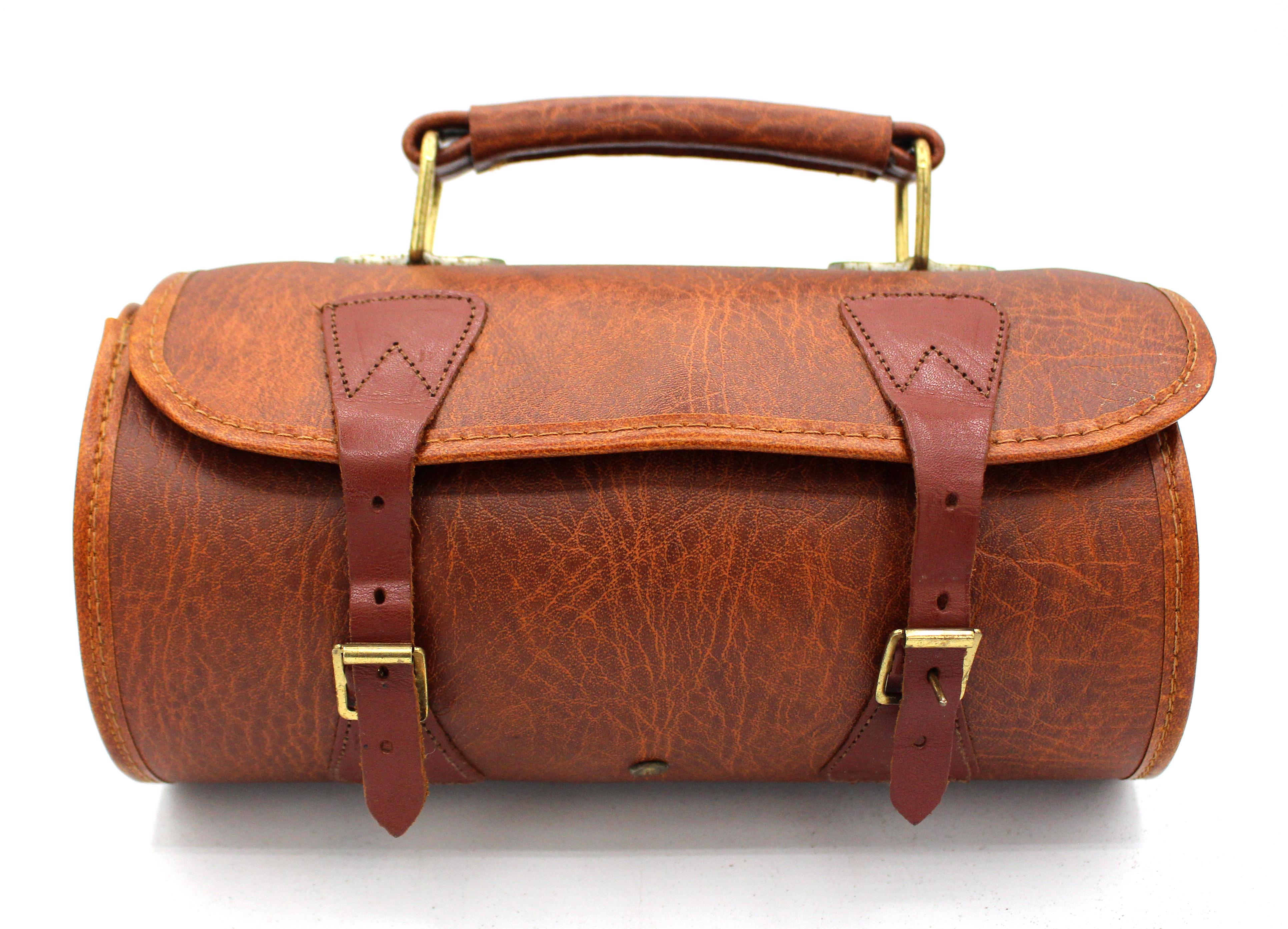 Early 20th century pair of lawn bowls in original case, English. Lignum vitae bowls in leather travel case with expected wear. Marked 