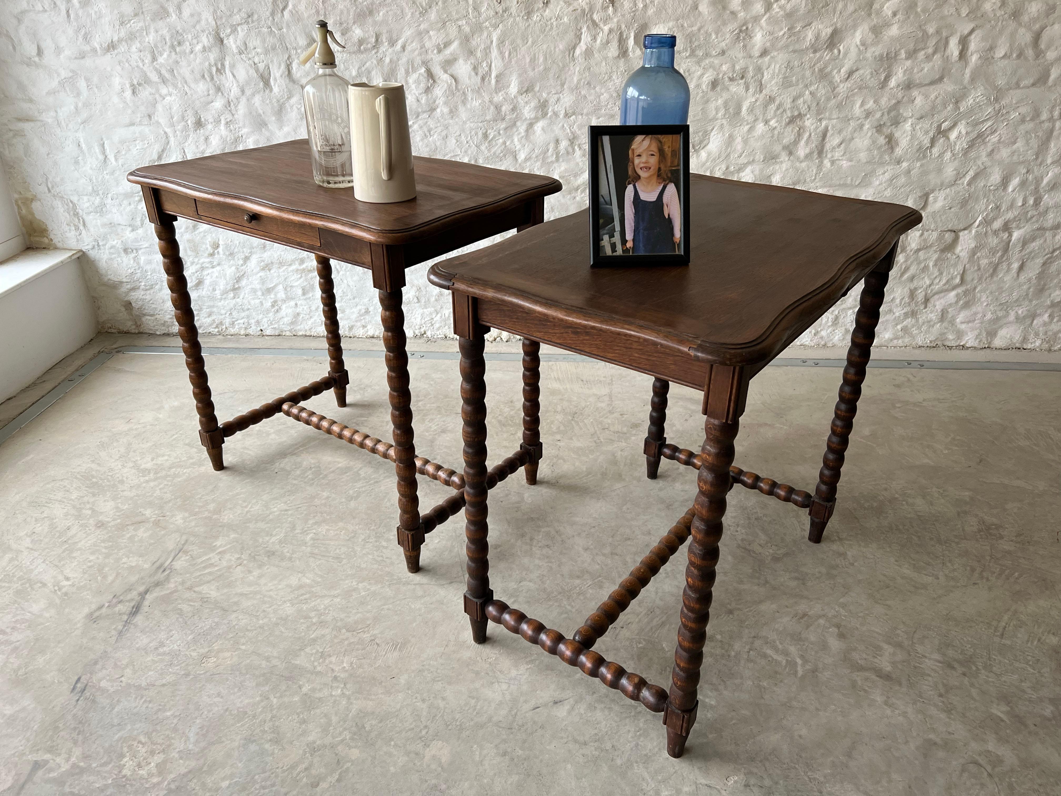 These fun French bobbin tables are mid 20th century and made from Oak. So easy to place as side tables in a sitting room or hallway or also could be used as bedside tables with their useful drawer.

In excellent condition having been