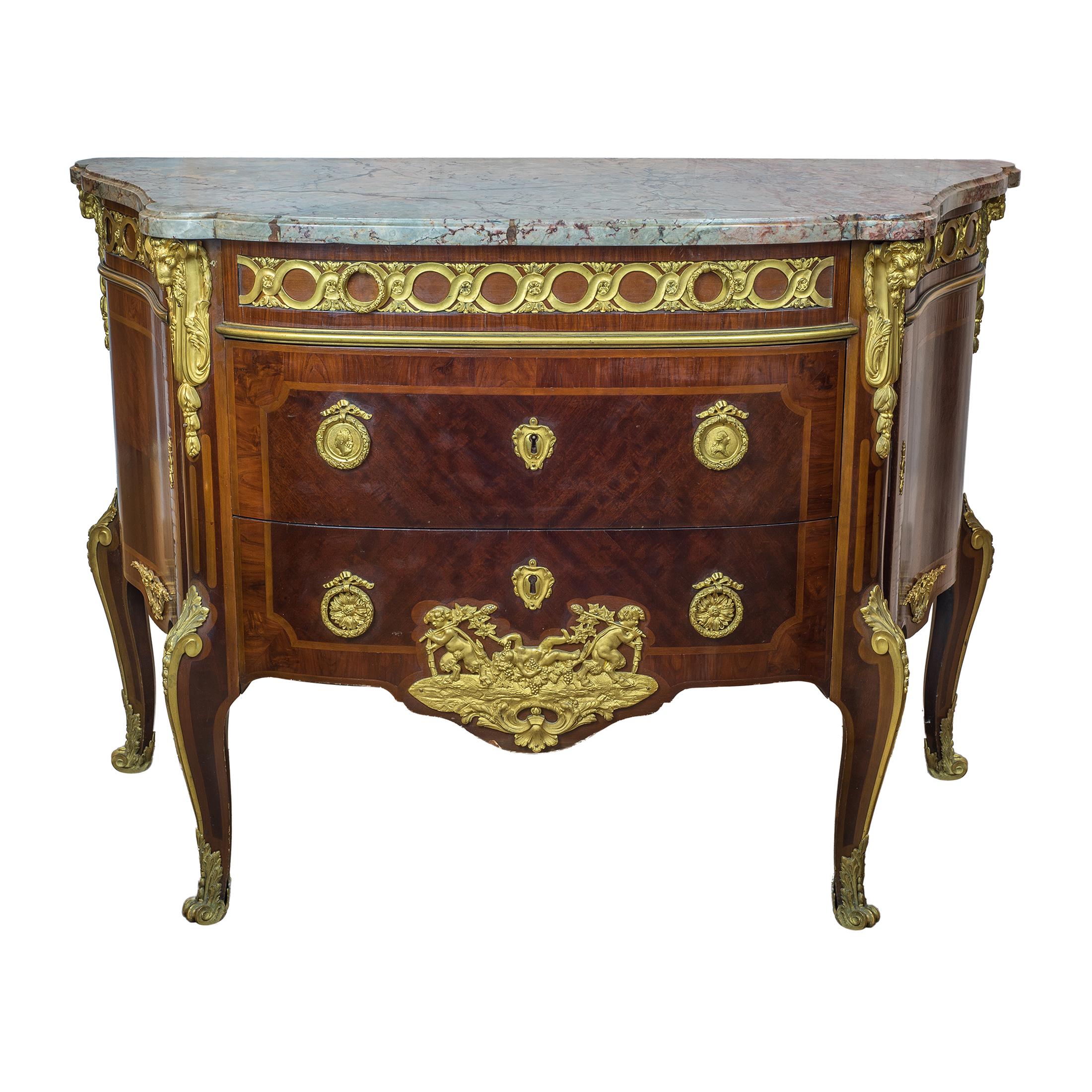 An exceptional pair of gilt bronze-mounted bas satin tulipwood and amaranth commode with serpentine fronted marble-top above a single frieze drawer and two long sans transverse. Each side fitted with a cupboard door opening to a single small shelf.