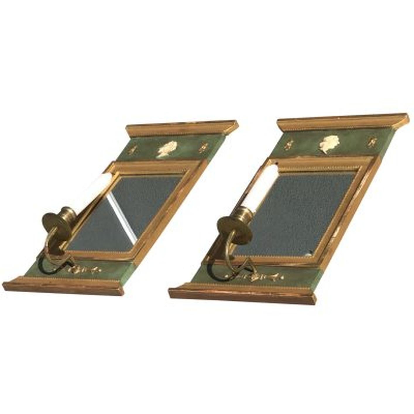 A vintage Art Deco pair of Swedish Gustavian wall sconces made of hand crafted wood and brass, the original glass is in good condition. The pair is partially gilded, composed with a mirror and with one candle cup each, signed by Kurt Ekvall. Wear