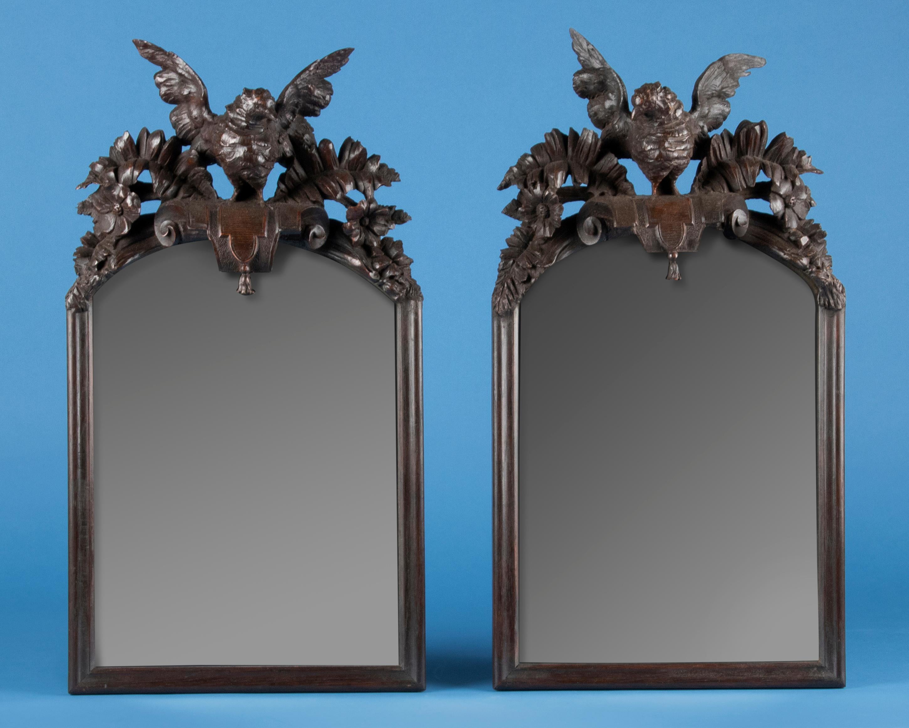 French Early 20th Century Pair of Hand Carved Oak Black Forest Style Carved Mirrors For Sale