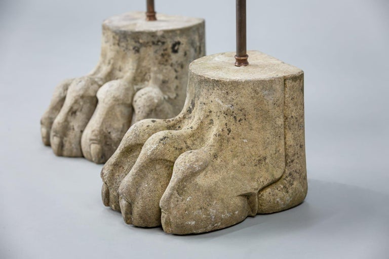 Large pair of early 20th century carved stone lion paw feet, nicely weathered, fitted and wired as lamps, PAT tested and ready to use, circa 1900.
Dimensions: 22cm x 47cm x 26cm.