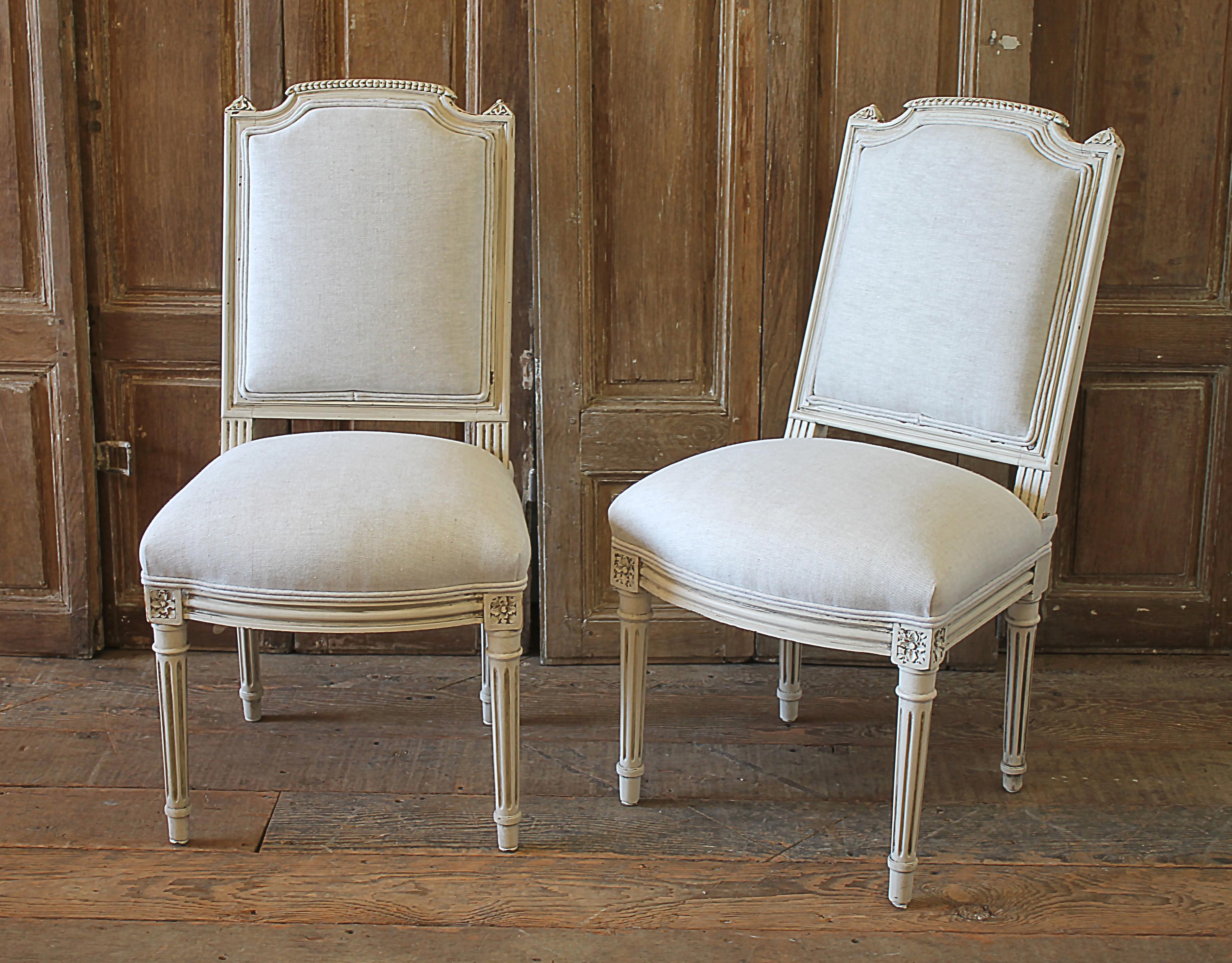 Very petite 20th century pair of painted chairs can be used for kids room. Beautiful pair of painted chairs in our oyster white finish, with subtle distressed edges, and finished with an antique glazed patina. Classic Louis XVI style. Reupholstered