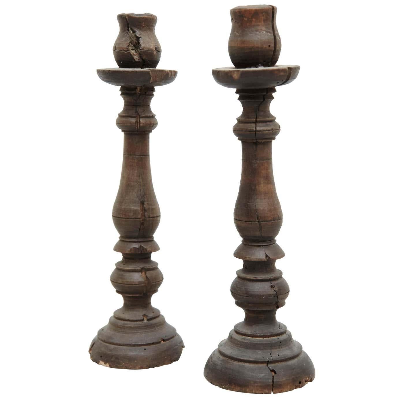 Mid-19th century pair of popular traditional rustic wood candlesticks.
By unknown manufacturer, France.

In original condition, with minor wear consistent with age and use, preserving a beautiful patina.

Materials:
Wood

Dimensions:
ø 10.5 cm x H