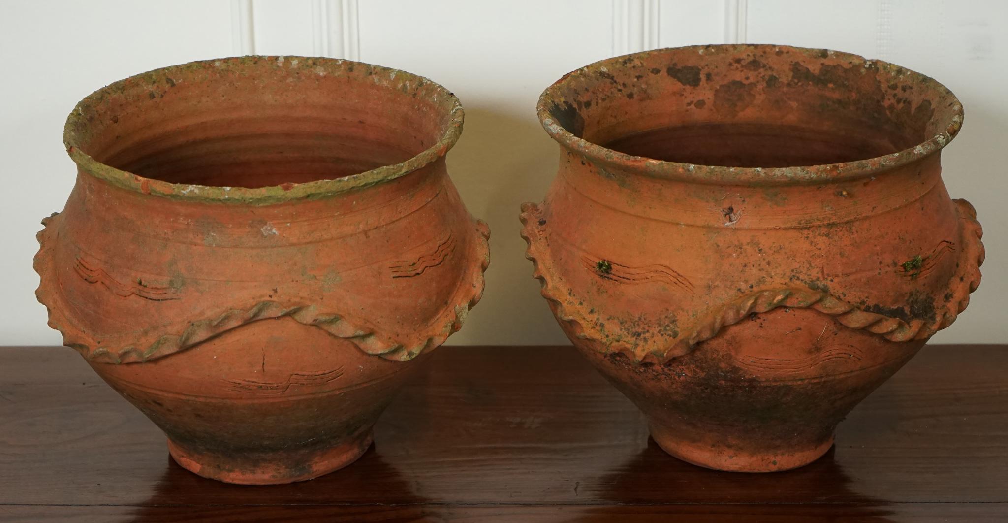 
We are delighted to offer for sale this A Pair Of Early 20th-century Terracotta Planter Pots.

 Exudes A Rustic charm and vintage appeal reminiscent of the era. These planters showcase the traditional craftsmanship and earthy warmth that terracotta