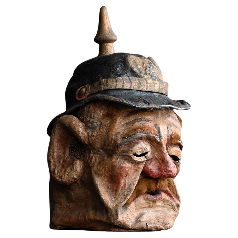 Masque de carnaval en papier mâché d'un soldat allemand du début du 20e siècle en vente