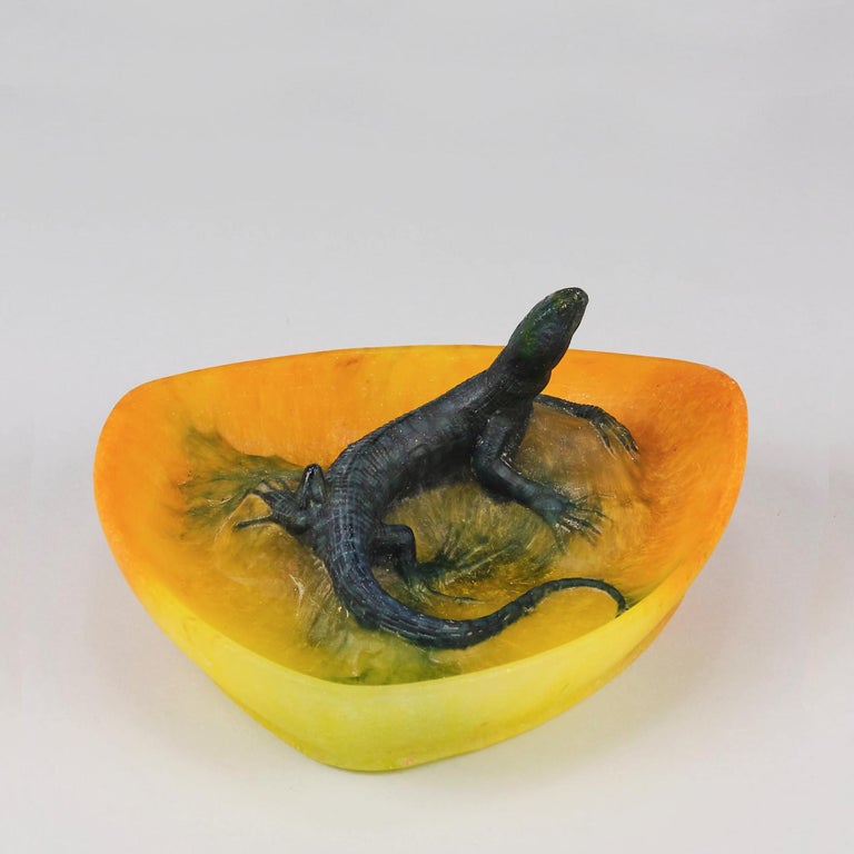A superb early 20th Century pate de verre glass vide poche decorated with a raised turning lizard, the tray in a rich golden yellow and the lizard in a deep naturalistic green colour exhbiting excellent detail, signed A Walter Nancy
ADDITIONAL