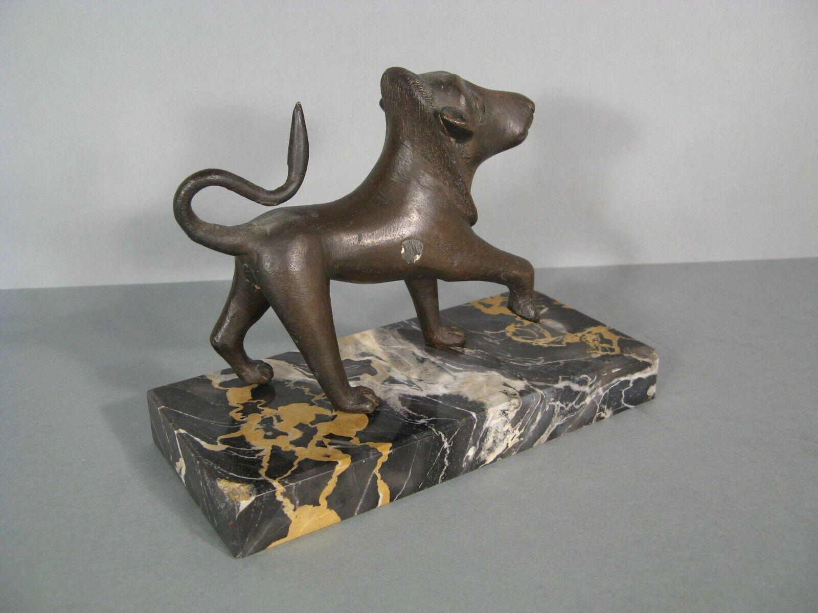 This antique bronze sculpture features a stylized lion, crafted with a patinated finish. The piece is an old edition bronze cast and is mounted on a marble base, dating back to the first half of the 20th century.

Features:

Material: Patinated