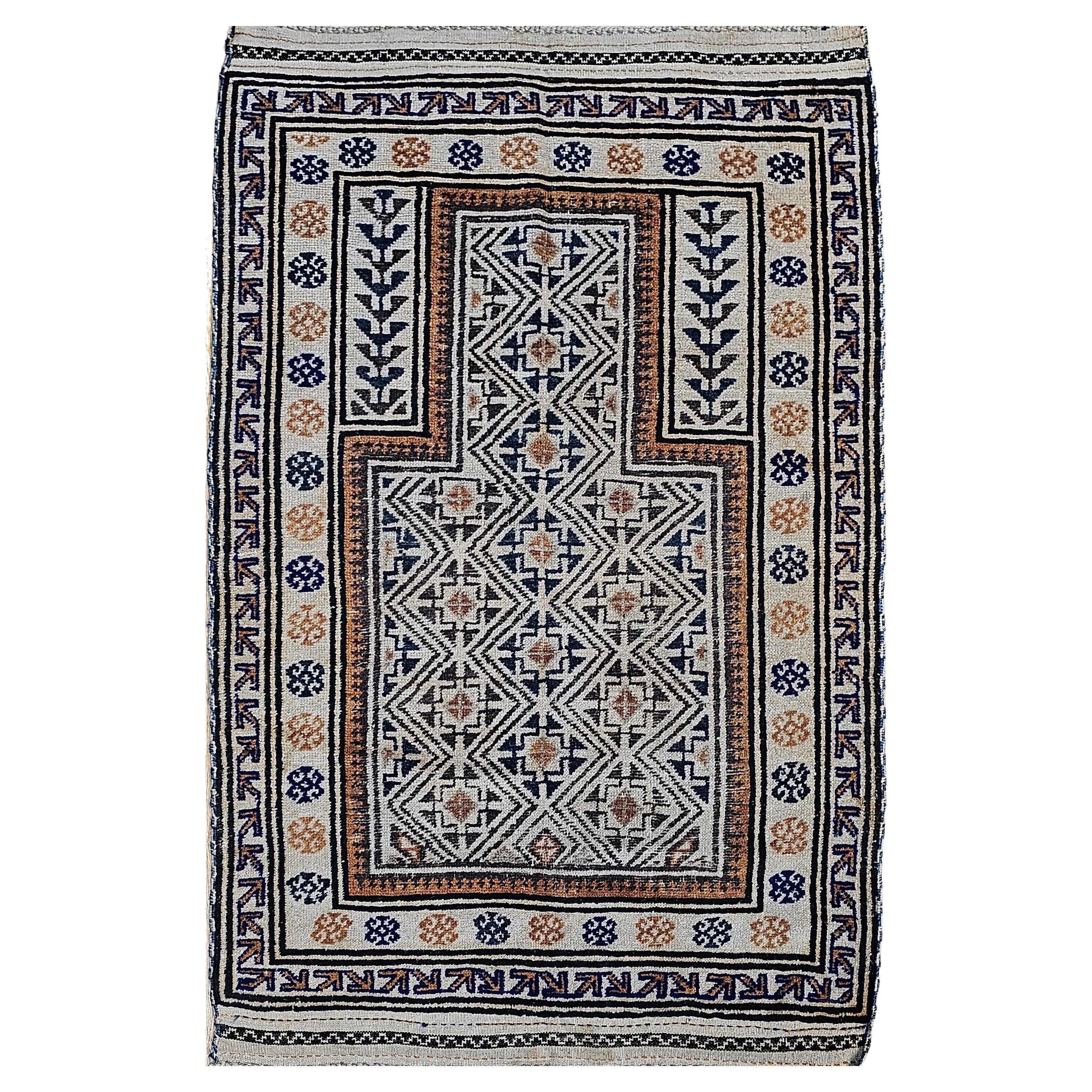 Early 20th Century Persian Baluch Prayer Rug Pattern in Ivory, Brown, Navy Blue For Sale