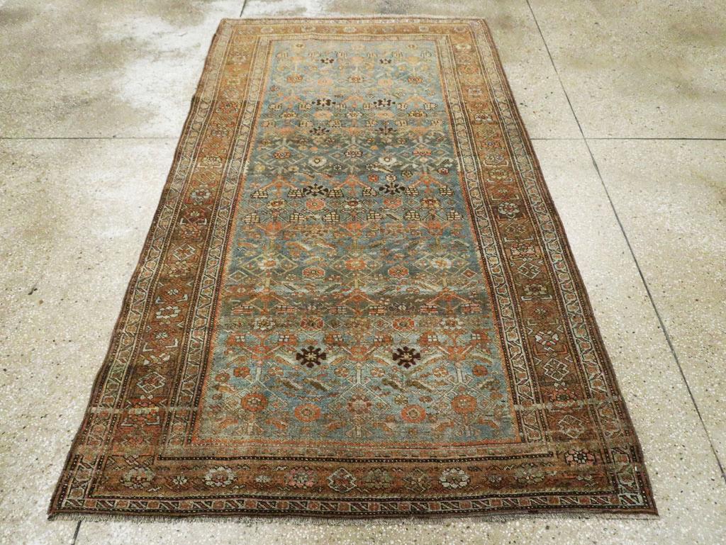 An antique Persian Bidjar accent rug handmade during the Early 20th century.

Measures: 4' 4