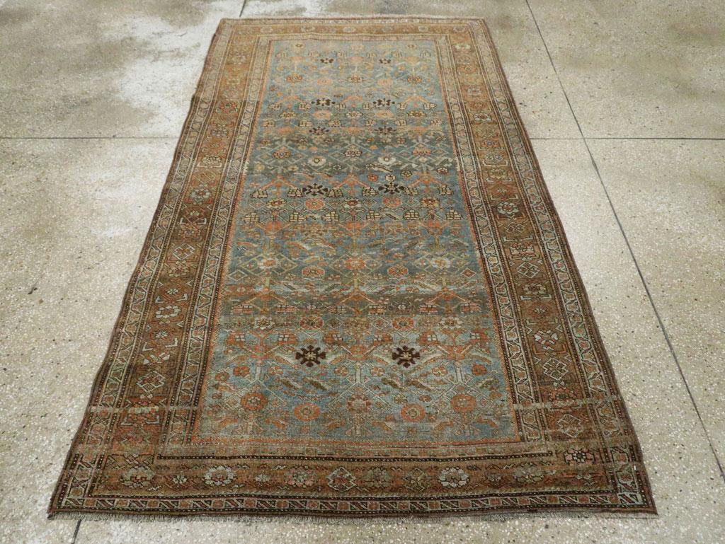 An antique Persian Bidjar accent rug handmade during the Early 20th century.

Measures: 4' 4