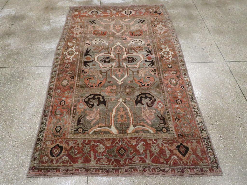An antique Persian Bidjar accent rug handmade during the Early 20th century.

Measures: 4' 9