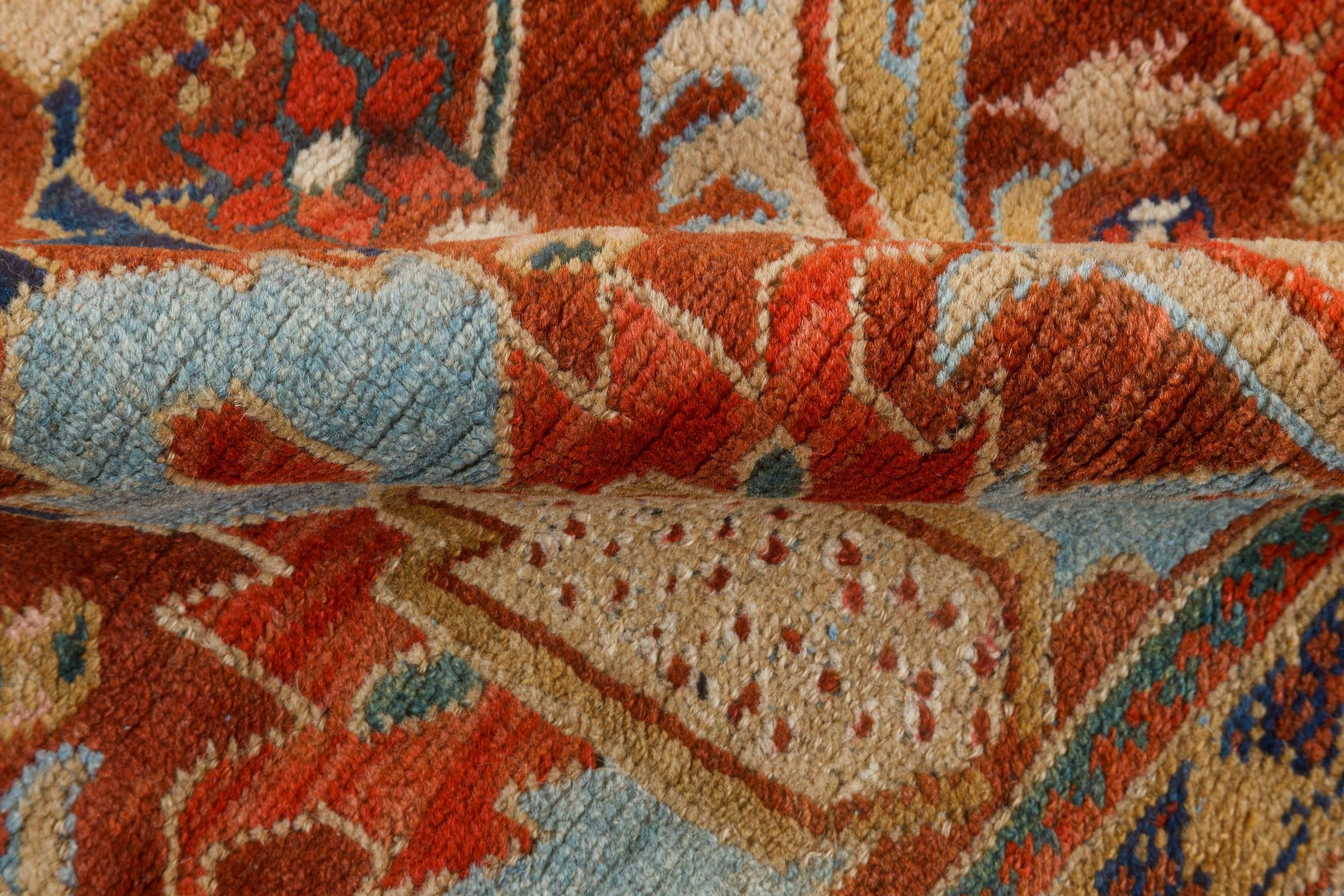 Early 20th Century Persian Heriz handwoven wool carpet
Size: 10'8