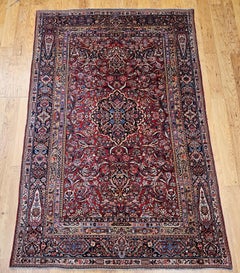 Early 20th Century Persian Kashan Area Rug in Floral Design in Red, Navy, Ivory