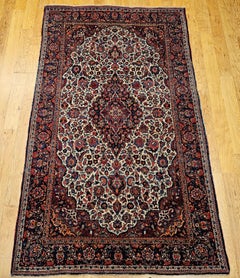 Persischer Kashan-Teppich des frühen 20. Jahrhunderts in Elfenbein, Marineblau, Rot, Grün, Rosa