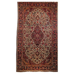 Tappeto persiano Kashan dei primi del Novecento in avorio, blu navy, rosso, verde, rosa