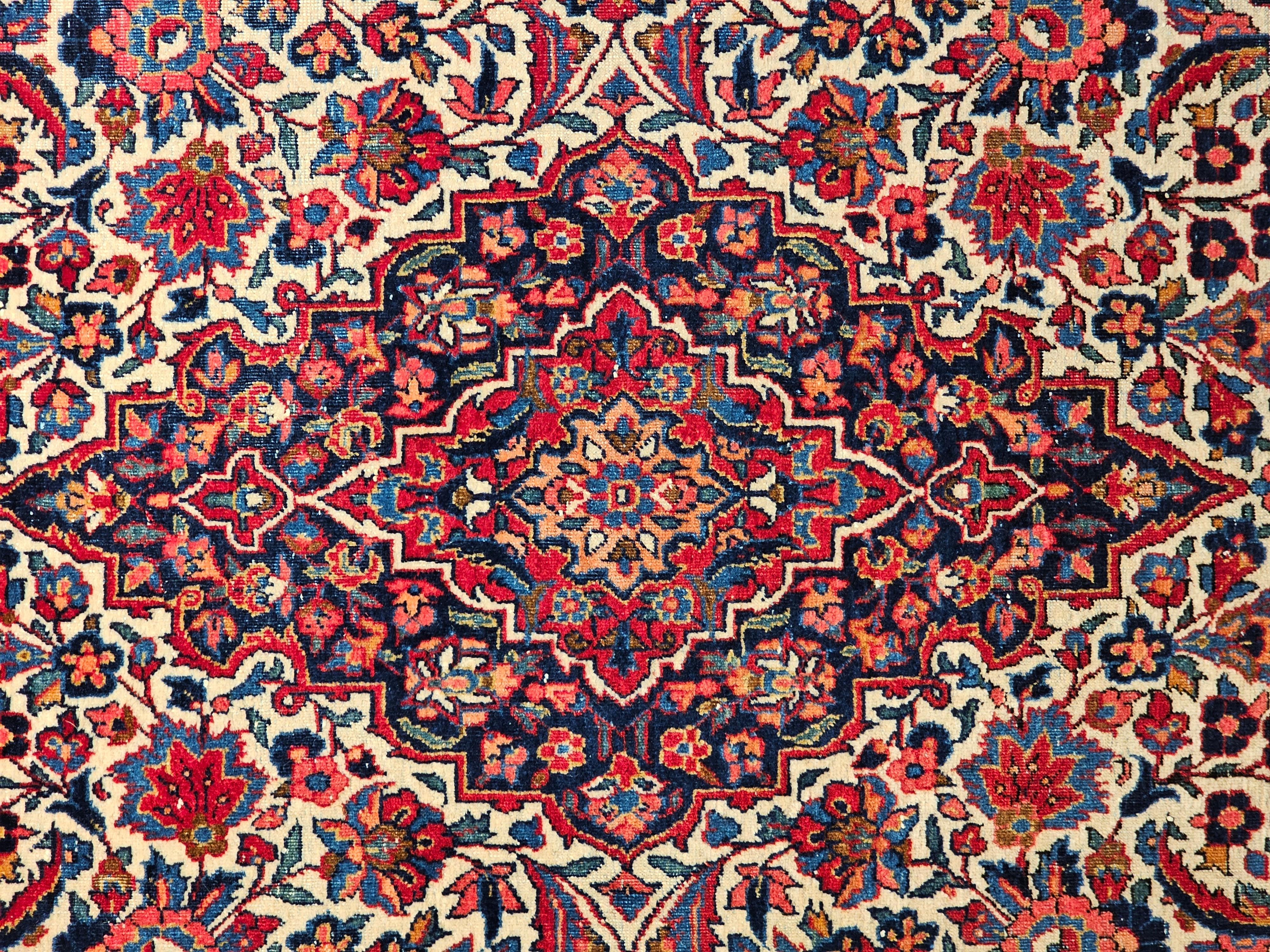 Wool Early 20th Century Persian Kashan in Floral Design in Ivory, Navy Blue, Red For Sale