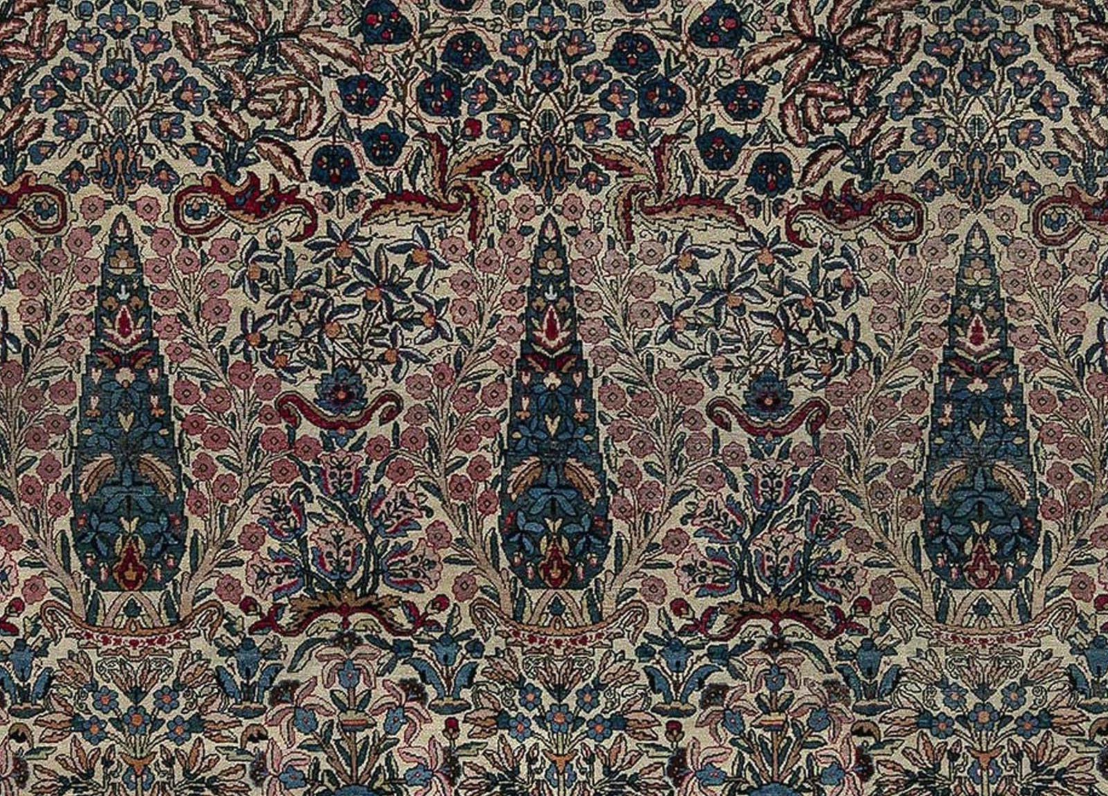 Early 20th century Persian Kirman wool rug in blue, brown, green, pink and red
Size: 10'2