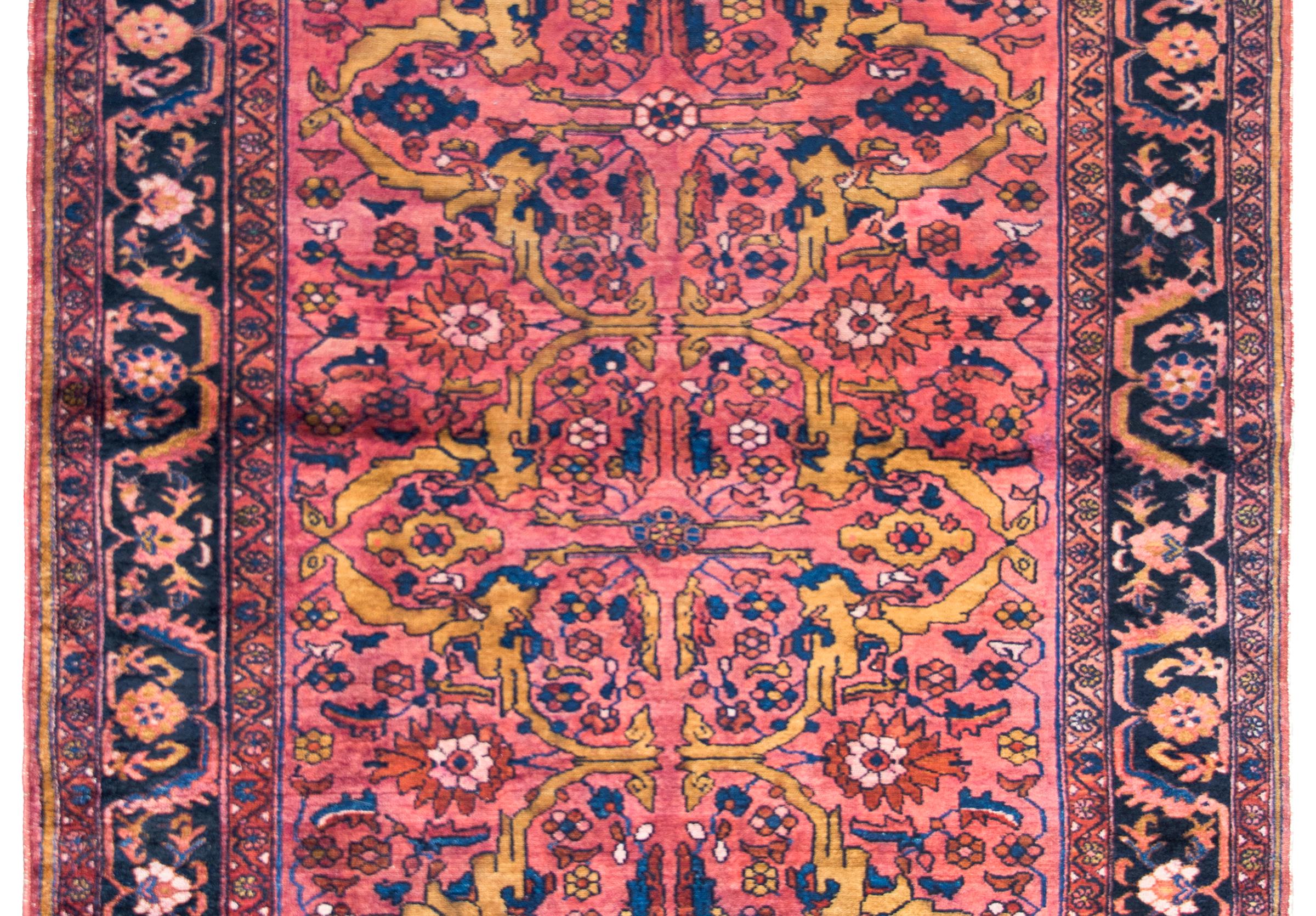 A striking early 20th century Persian Lilihan rug with the most beautiful field with myriad stylized flower and leaves surrounded by a stunning border with a central floral stripe flanked by a pair of petite matching floral partnered stripes, and