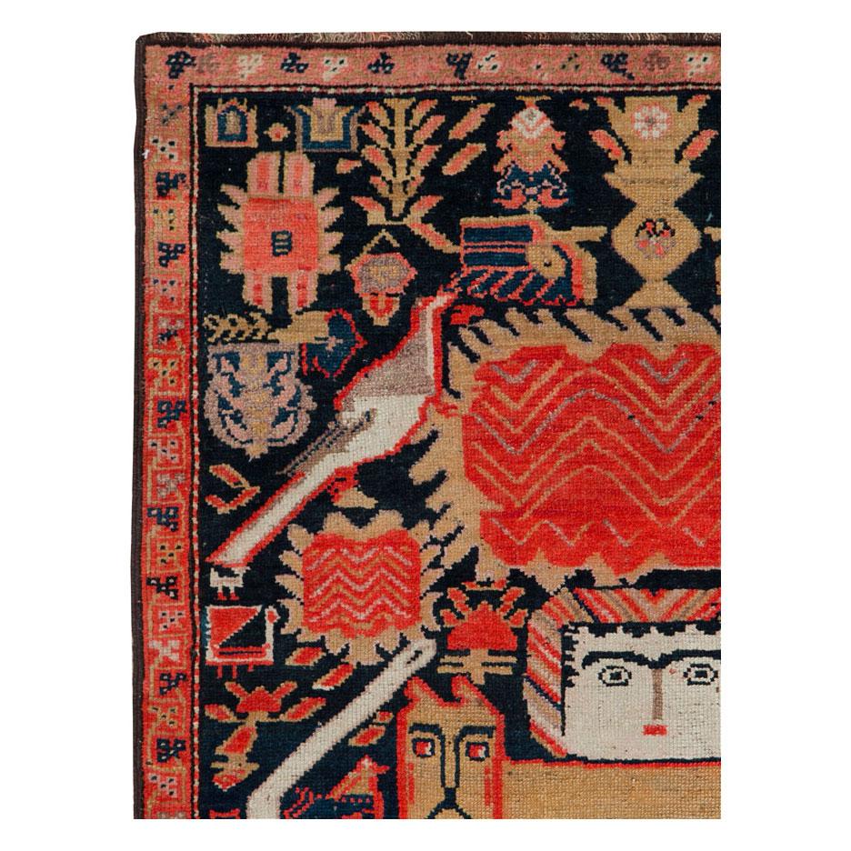 An antique Persian Malayer small throw rug handmade during the early 20th century with a rustic design of animals and flowers, and a pictorial depiction of the Classic Persian lion with sword and sun symbol as the focal point.

Measures: 3' 6
