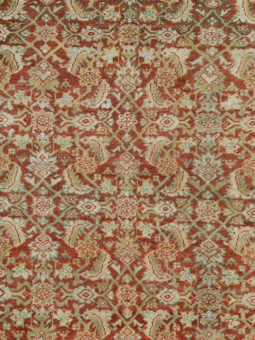 An antique Persian Mahal accent carpet. The brown field of this west Persian rural smallish carpet displays an extremely well-balanced medium scale allover Herati design with tan, cream and light brown accents, set within an abrashing to slate main