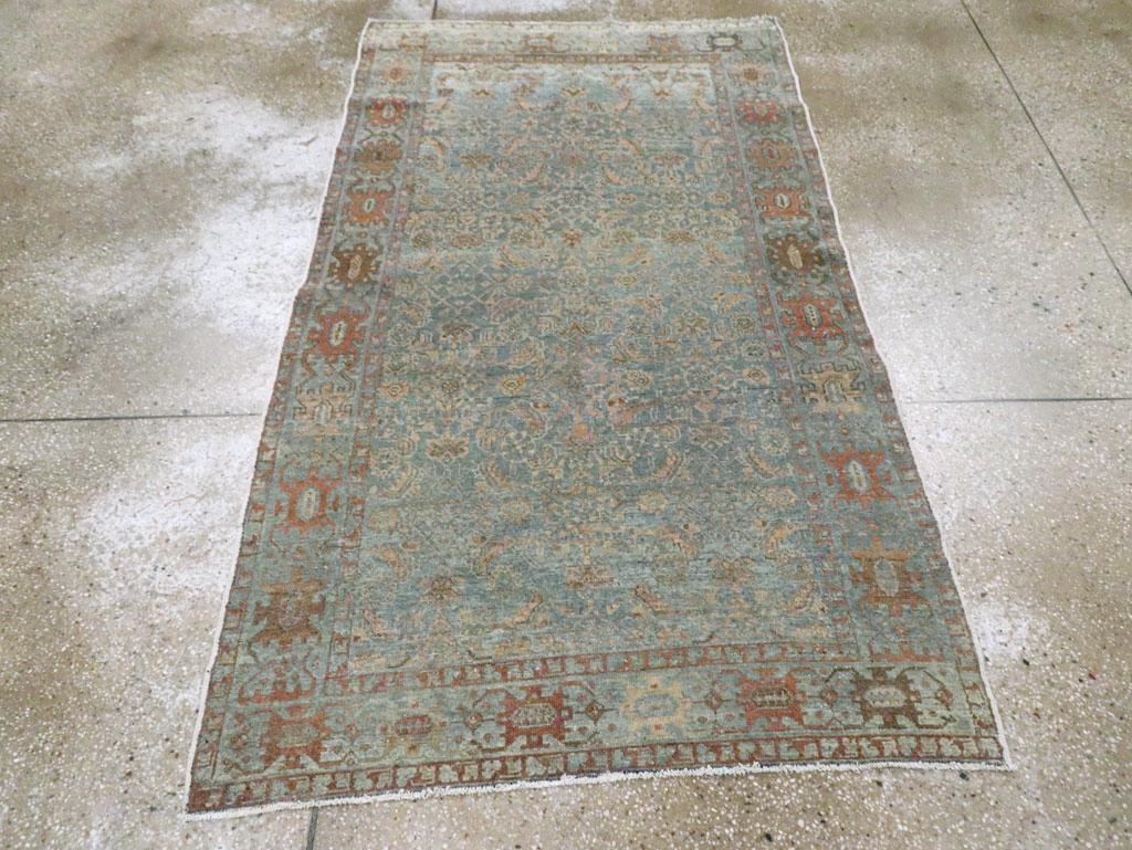 An antique Persian Malayer accent rug handmade during the Early 20th century.

Measures: 3' 7